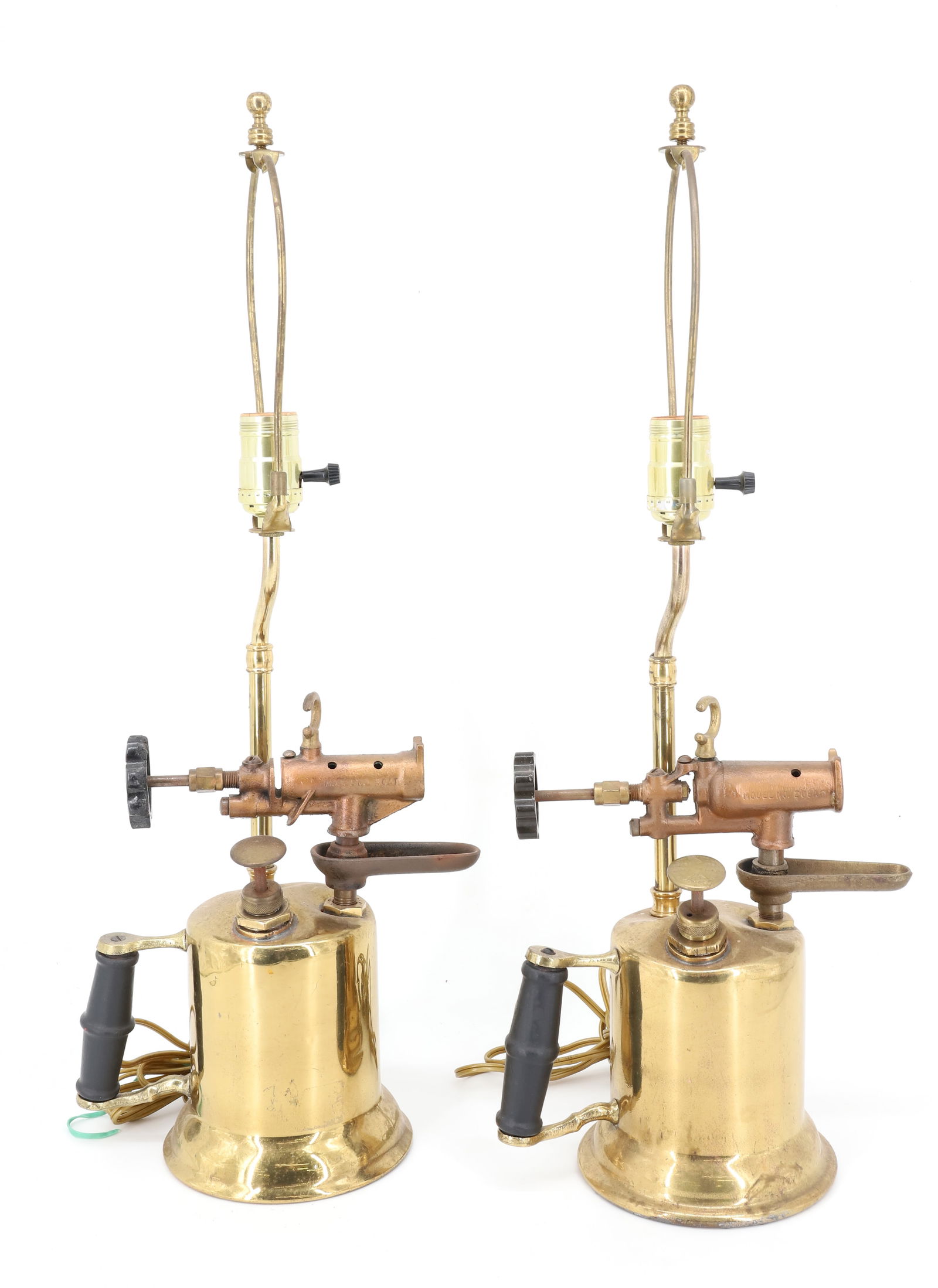PAIR OF BRASS BLOW TORCH LAMPS: BRASS AND WOOD. CONVERTED TO LAMPS. 23" TOTAL HEIGHTS.