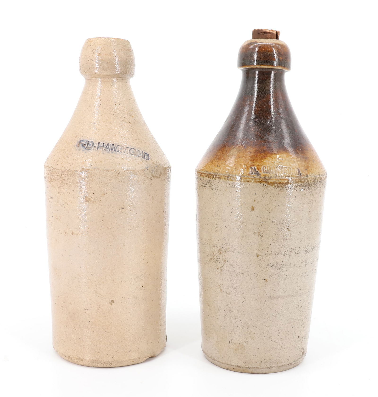 (2) STONEWARE ADVERTISING BOTTLES (1 of 7)