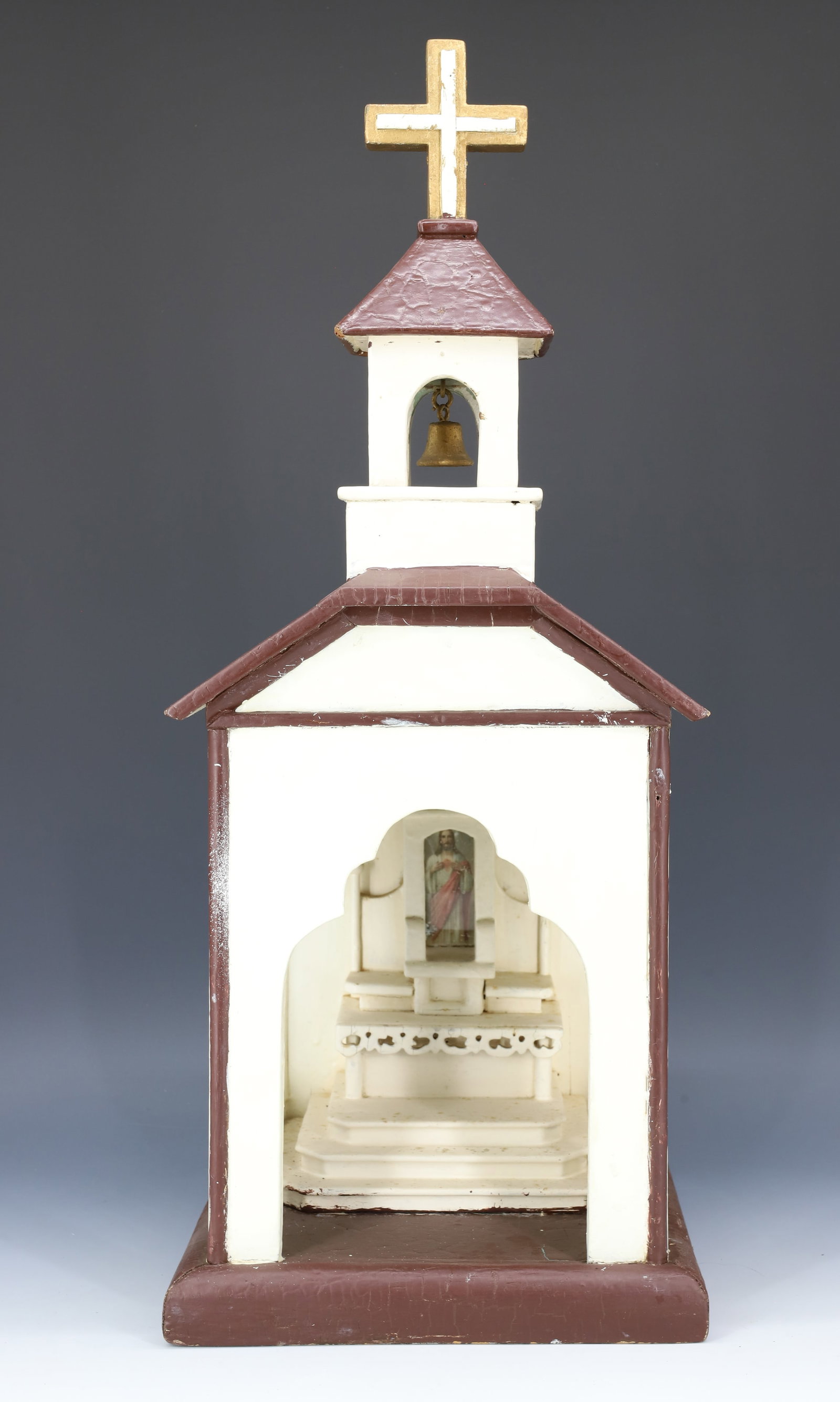 FOLK ART WOODEN CHURCH: HANDMADE AND PAINTED WITH BELL IN THE TOWER AND ALTER INSIDE. 22" X 9" X 9".