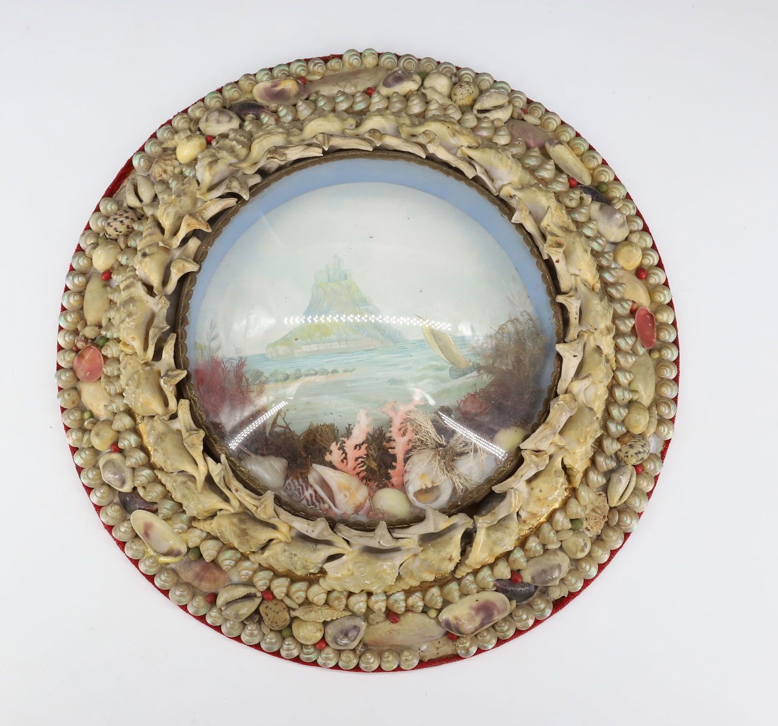 VICTORIAN SHELL ART DIORAMA: SHELL BORDER. CONVEX GLASS WITH COASTAL SCENE. 9 3/4" D.