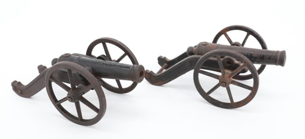 PAIR OF CAST IRON MINIATURE CANNONS
