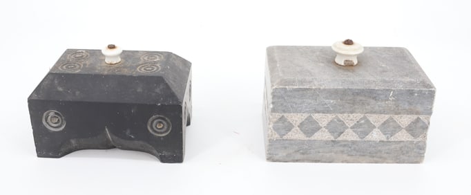 PAIR OF CARVED STONE DOORSTOPS