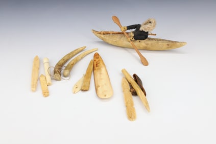 INUIT MODEL KAYAK AND CARVED BONE IMPLEMENTS