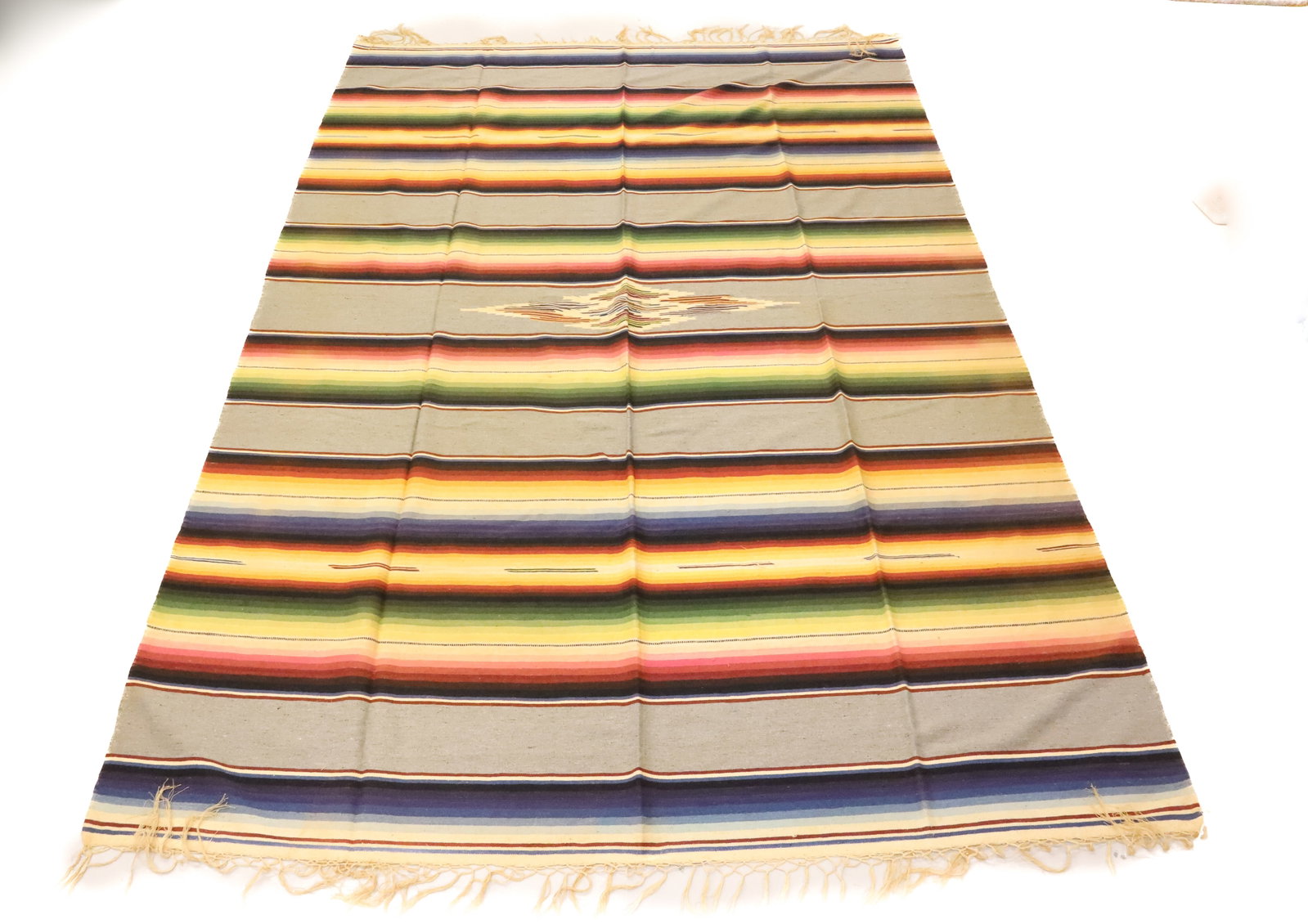 VINTAGE MEXICAN SERAPE: MUTED RAINBOW COLORS. FRINGE EDGES. 91" X 63"