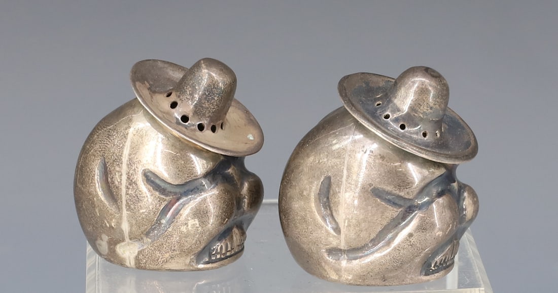 STERLING SILVER MEXICAN SHAKERS: FIGURAL SIESTA SHAKERS 925 MARK 1 3/4" H TOTAL WEIGHT 1.56 OZT PLEASE READ CAREFULLY - Terms for Purchasing and Shipping of Auction Items. Please read carefully before bidding. Hartzell’s Auction Ga