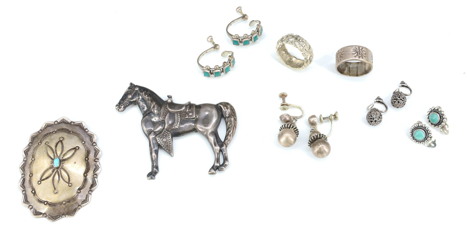 STERLING SILVER JEWELRY LOT: HORSE PIN, TWO RINGS SIZE 8, NATIVE AMERICAN BUTTON, FOUR PAIR EARRINGS SOME WITH METAL BACKS TOTAL WEIGHT 1.8 OZT 2 1/4" X 2 1/2" HORSE LARGEST PLEASE READ CAREFULLY - Terms for Purchasing and Shippi