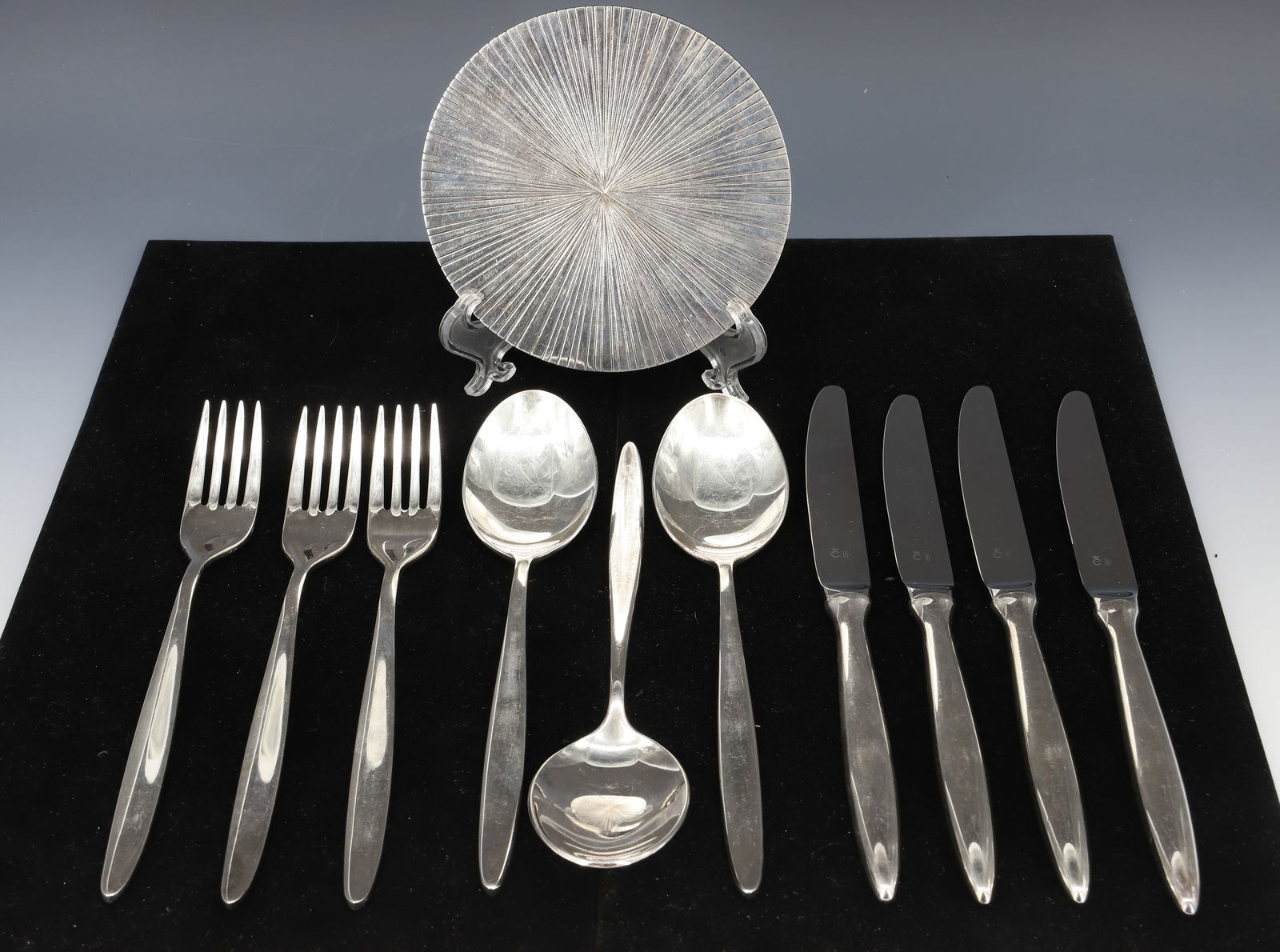 CHRISTOFLE AND SWEDISH SILVERPLATE: CHRISTOFLE MODERNIST WINE COASTER DESIGNER MICHELE OKA DONER SILVERED BRONZE 5" DIA AND (10) SWEDISH SILVERPLATE FLATWARE 8" PLEASE READ CAREFULLY - Terms for Purchasing and Shipping of Auction Items.