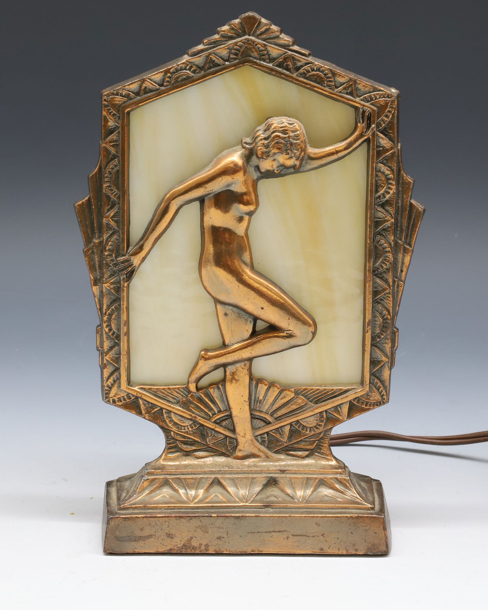 ART DECO NUDE SLAG GLASS TABLE LAMP: BUTTERSCOTCH SLAG GLASS POSED NUDE WITHIN ART DECO FRAME BRONZE FINISH VERY GOOD CONDITION 9 1/4" X 6" PLEASE READ CAREFULLY - Terms for Purchasing and Shipping of Auction Items. Please read carefully