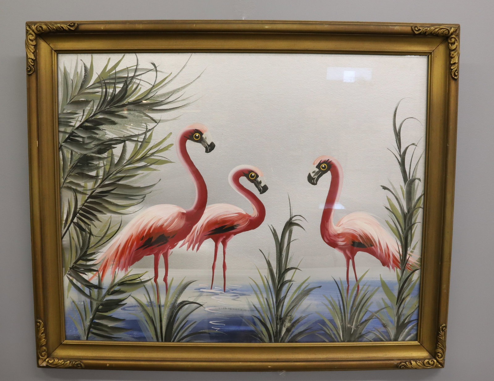 1940S HAND FLAMINGO PAINTING: PAINTED ON SILVER COLOR BOARD THREE FLAMINGOS AND PALMS IN PAINTED GOLD FRAME OVERALL 28" 34 1/2" PLEASE READ CAREFULLY - Terms for Purchasing and Shipping of Auction Items. Please read carefully befo