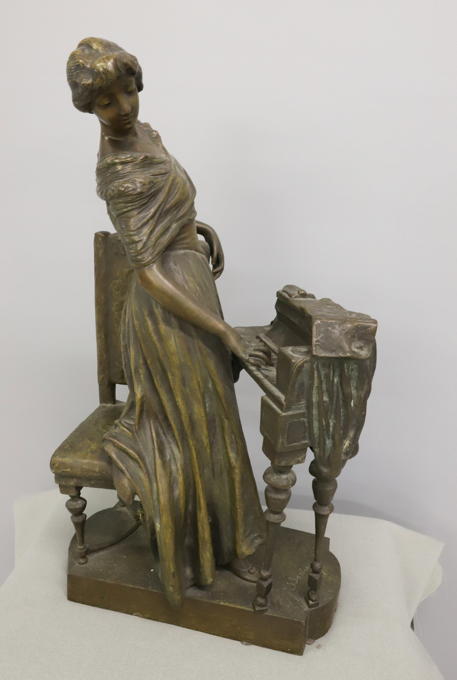 SAVERID SORTINI BRONZE SCULPTURE: SAVERID SORTINI 1860-1925 WOMAN PLAYING A PIANOFORTE 27" X 14 1/2" X 8" PLEASE READ CAREFULLY - Terms for Purchasing and Shipping of Auction Items. Please read carefully before bidding. Hartzell’s A