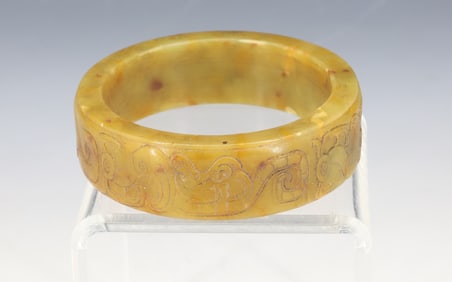 CARVED OLIVE GREEN JADEITE BANGLE