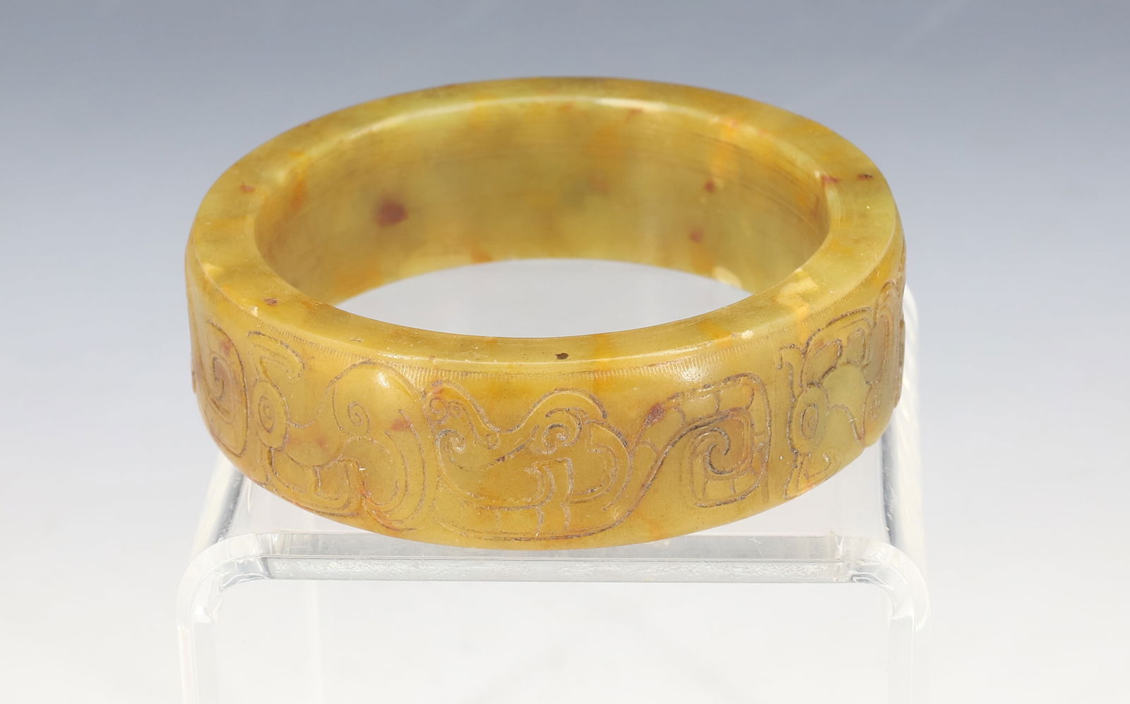 CARVED OLIVE GREEN JADEITE BANGLE: 7/8" X 3 1/4" CARVED SHALLOW RELIEF DESIGN PLEASE READ CAREFULLY - Terms for Purchasing and Shipping of Auction Items. Please read carefully before bidding. Hartzell’s Auction Gallery. Hartzell's Au