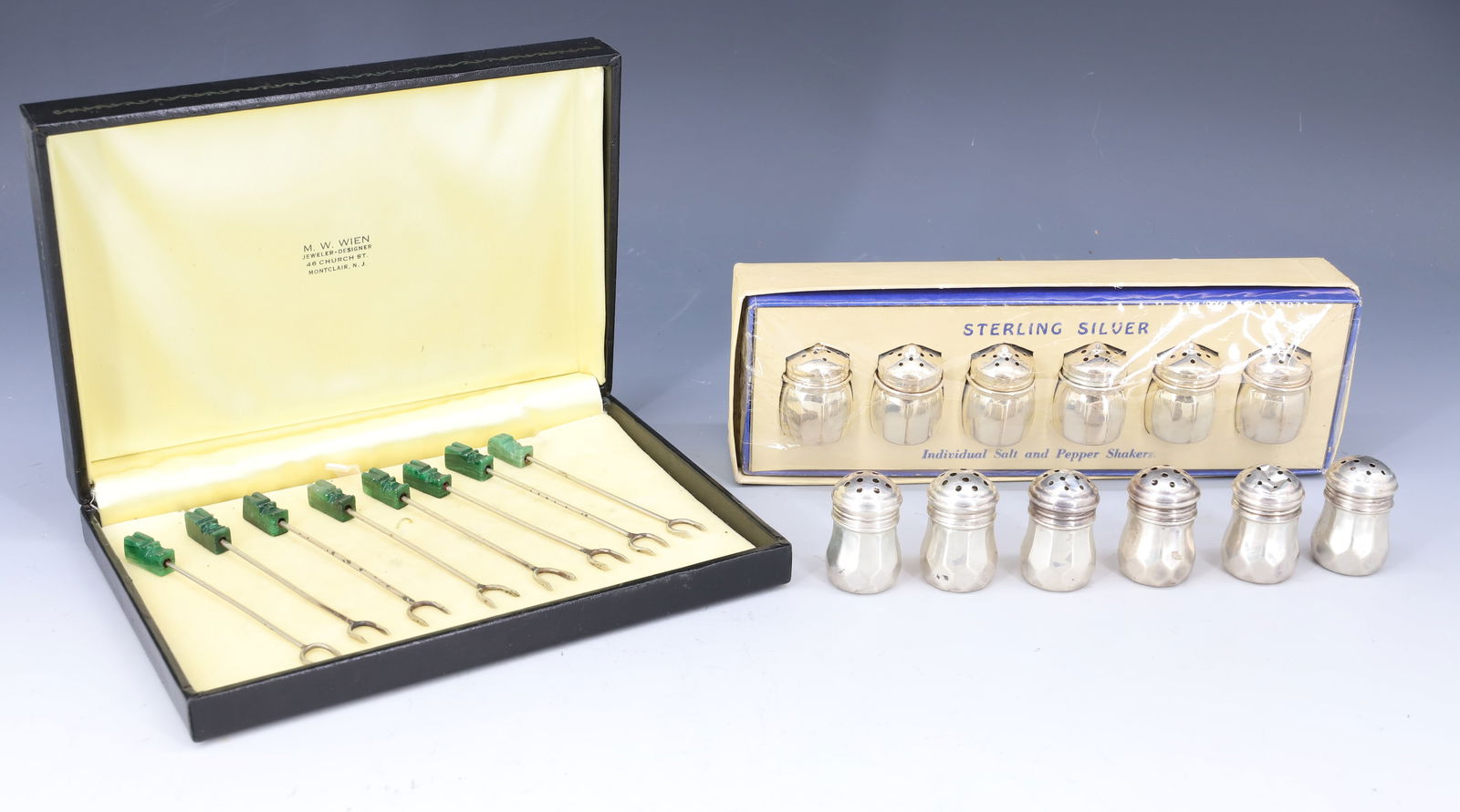 (2) SETS OF STERLING SILVER SHAKERS: EACH SET (6) SHAKERS ONE SET STILL IN PACKAGE (6) COCKTAIL FORKS METAL TOTAL WEIGHT FOR SILVER 1.4 OZT 1 1/4"H PLEASE READ CAREFULLY - Terms for Purchasing and Shipping of Auction Items. Please read c