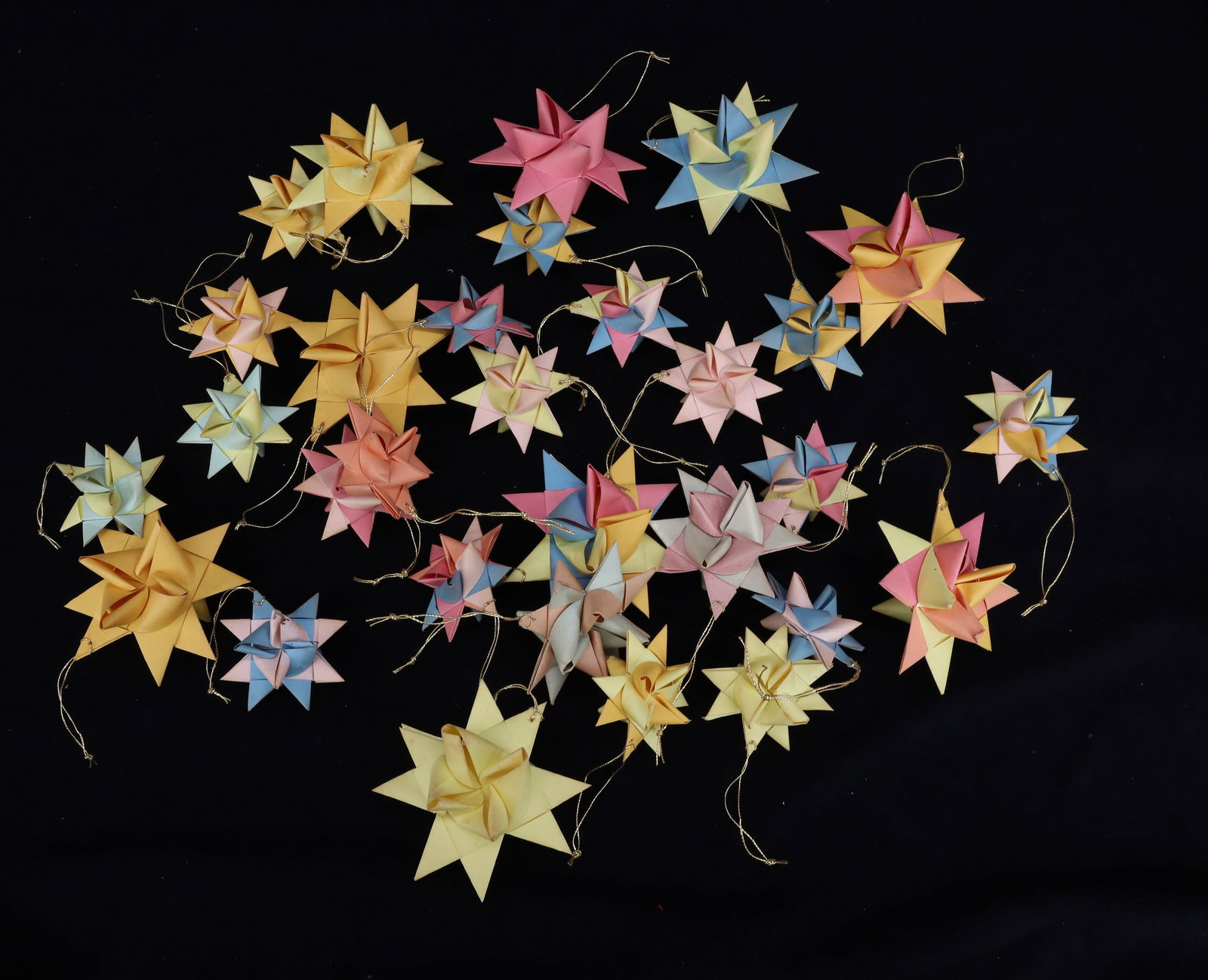 (30) FOLDED PAPER MORAVIAN STARS: VARIOUS SIZES AND COLORS. LARGEST 3 1/4" D. PLEASE READ CAREFULLY - THIS IS AN ONLINE ONLY AUCTION -Terms for Purchasing and Shipping of Auction Items. Please read carefully before bidding. Hartzell?s