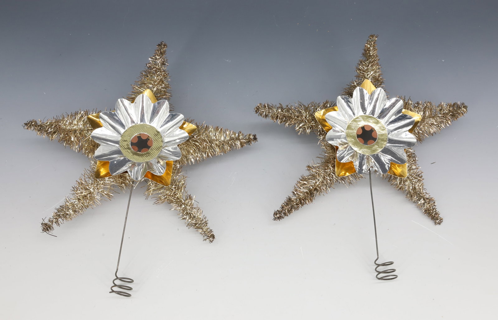 PAIR OF TINSEL STAR TREE TOPPERS: TINSEL / WIRE / ALUMINUM 9 1/2" X 8". PLEASE READ CAREFULLY - THIS IS AN ONLINE ONLY AUCTION -Terms for Purchasing and Shipping of Auction Items. Please read carefully before bidding. Hartzell?s Aucti