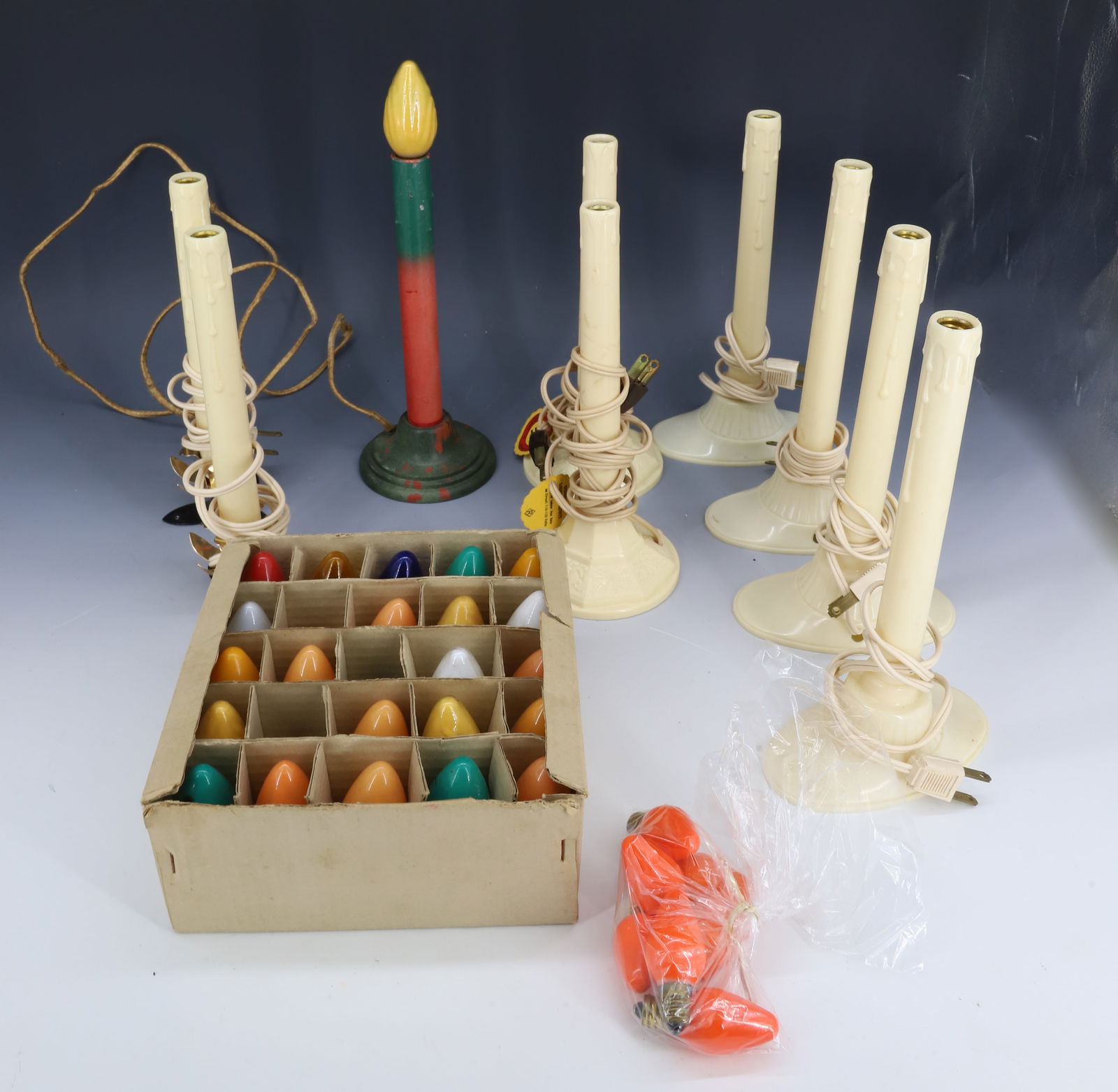 LOT OF VINTAGE CHRISTMAS CANDLES: (9) CANDLES AND BULBS. 8 3/4" H. PLEASE READ CAREFULLY - THIS IS AN ONLINE ONLY AUCTION -Terms for Purchasing and Shipping of Auction Items. Please read carefully before bidding. Hartzell?s Auction Ga