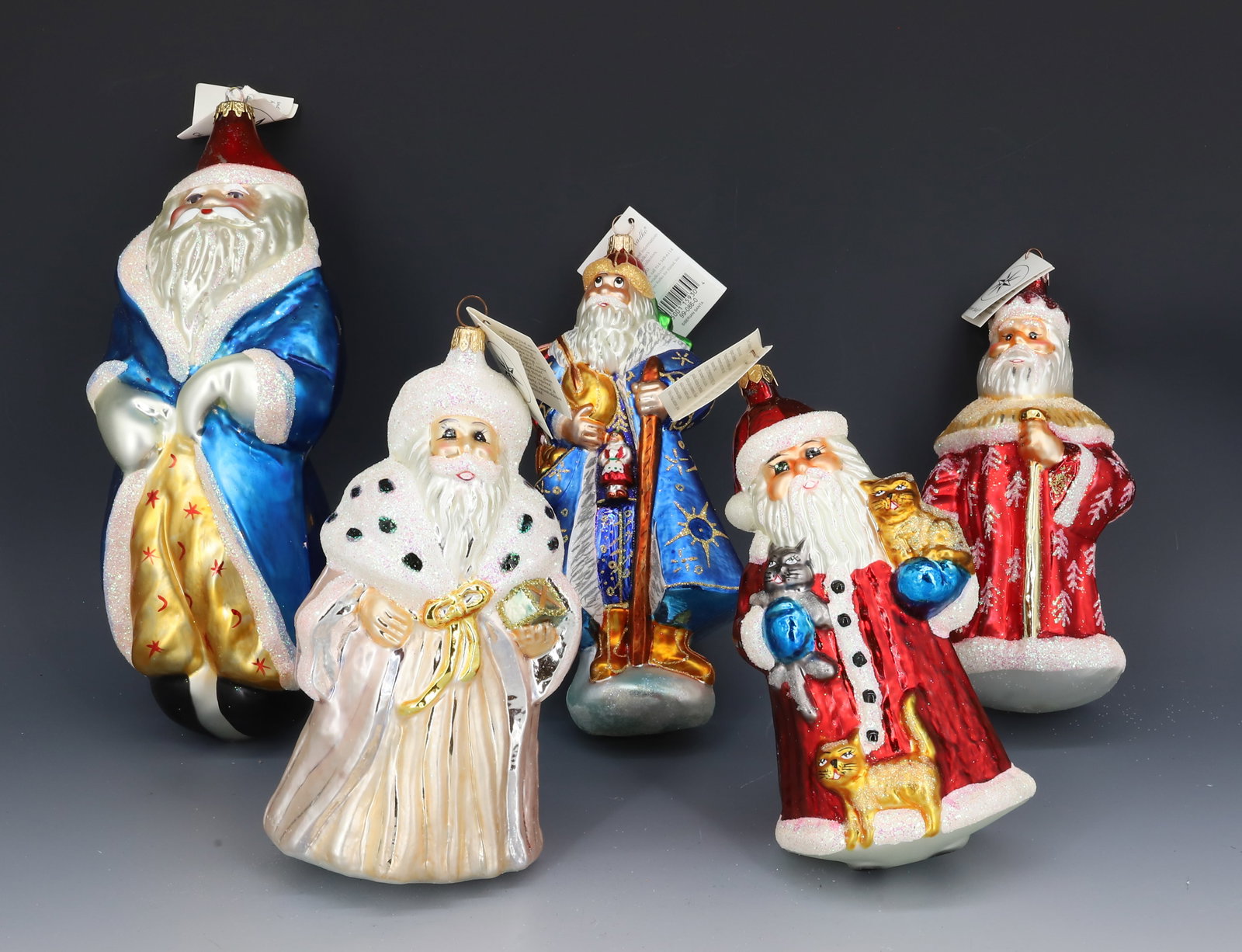 (5) VINTAGE CHRISTOPHER RADKO GLASS SANTA CLAUS ORNAMENTS: VARIOUS VERSIONS OF SANTA CLAUS. ORIGINAL TAGS. MADE IN POLAND. PLEASE READ CAREFULLY - THIS IS AN ONLINE ONLY AUCTION -Terms for Purchasing and Shipping of Auction Items. Please read carefully before