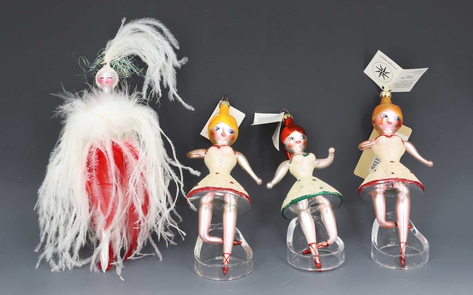 (4) VINTAGE CHRISTOPHER RADKO GLASS ORNAMENTS: FOUR DANCERS / PERFORMERS. MADE IN ITALY. ORIGINAL TAGS. LARGEST 8" L. PLEASE READ CAREFULLY - THIS IS AN ONLINE ONLY AUCTION -Terms for Purchasing and Shipping of Auction Items. Please read carefully