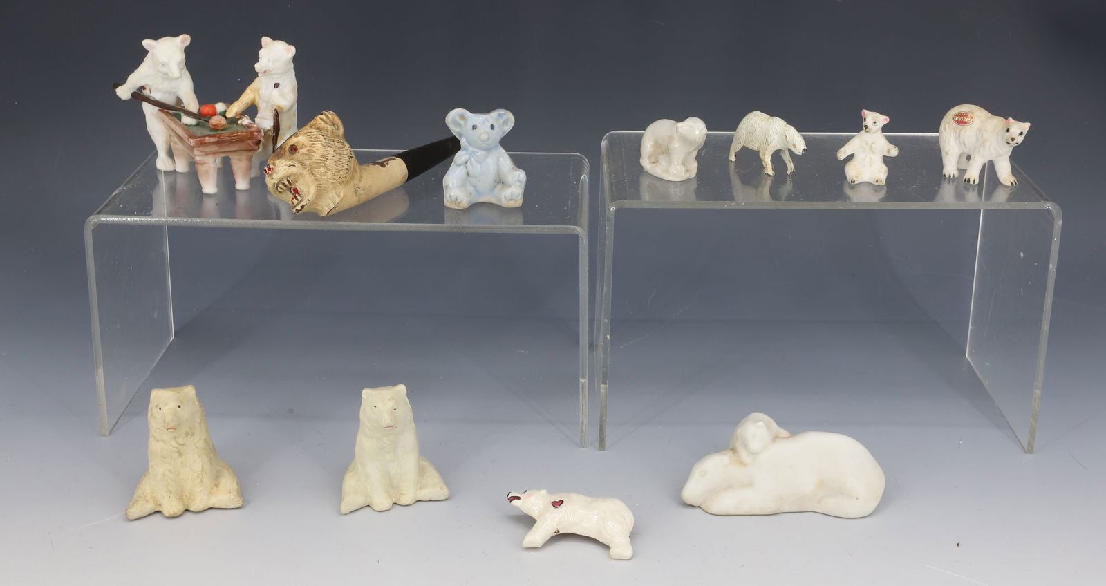LOT OF BISQUE POLAR BEAR FIGURES: VARIETY OF SIZES AND POSES. LARGEST 2 1/2" H. INCLUDES POLAR BEAR PIPE 5 1/4". PLEASE READ CAREFULLY - THIS IS AN ONLINE ONLY AUCTION -Terms for Purchasing and Shipping of Auction Items. Please read c