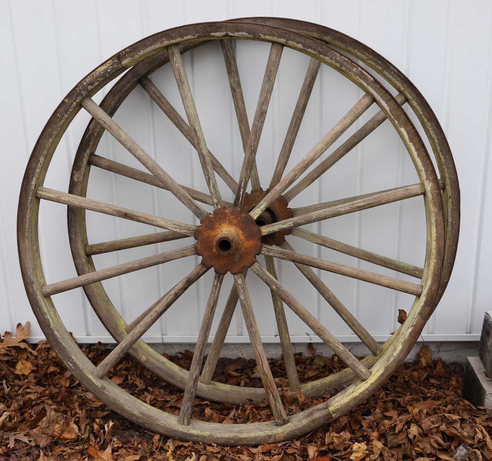 (2) WOOD / IRON FARM WHEELS: WOODEN SPINDLES WITH IRON BANDING. 45 1/2" D. PLEASE READ CAREFULLY - Terms for Purchasing and Shipping of Auction Items. Please read carefully before bidding. Hartzell?s Auction Gallery. Hartzell's A