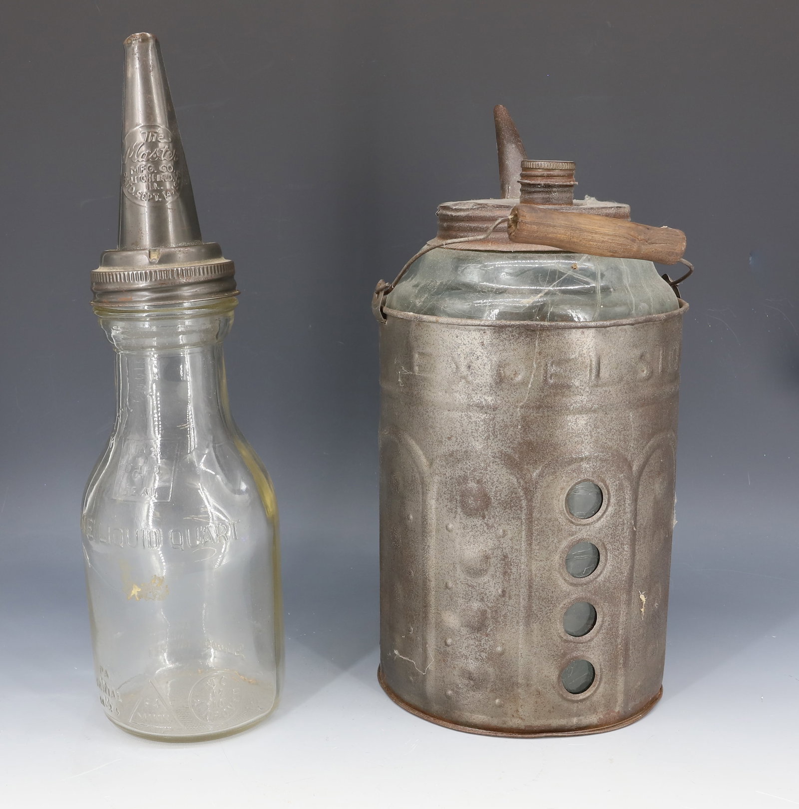 KEROSENE AND OIL CONTAINERS: "EXCELSIOR" KEROSENE CONTAINER, GLASS WITH EMBOSSED TIN SLEEVE 10 1/2" H. GLASS OIL QUART JAR WITH TIN POUR (MRKD. THE MASTER, PAT. 1926) 13 1/2" H. PLEASE READ CAREFULLY - Terms for Purchasing and Sh