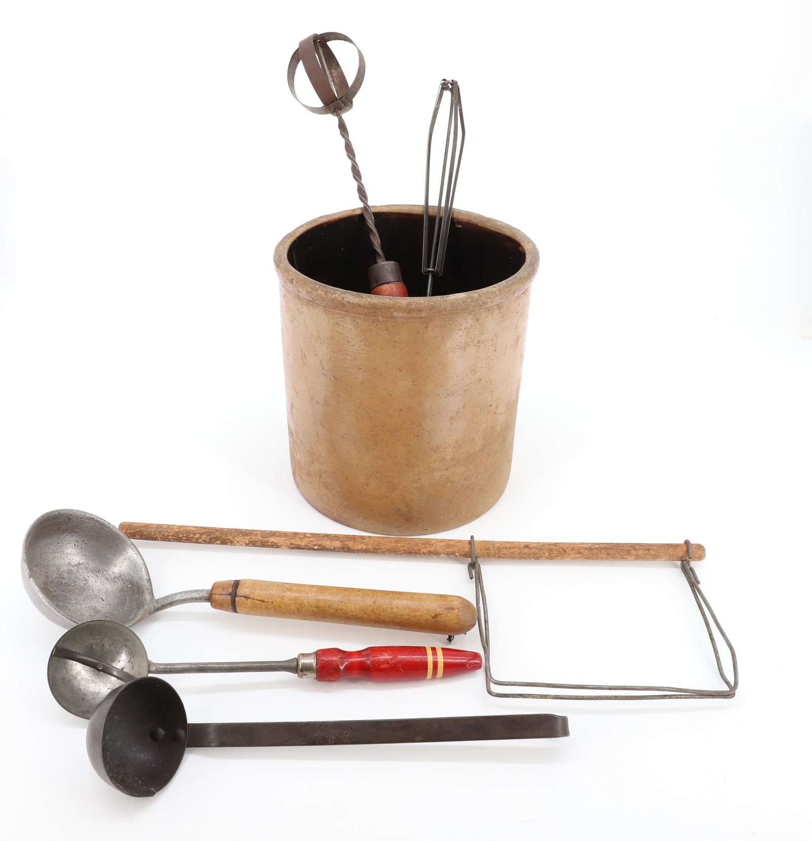 STONEWARE CROCK WITH KITCHEN UTENSILS: CROCK IS 7 1/2" X 7 1/4". TWO METAL WHIPPERS (RED HANDLE 15" L.), ICE CREAM SCOOPS AND MORE. PLEASE READ CAREFULLY - Terms for Purchasing and Shipping of Auction Items. Please read carefully before bi