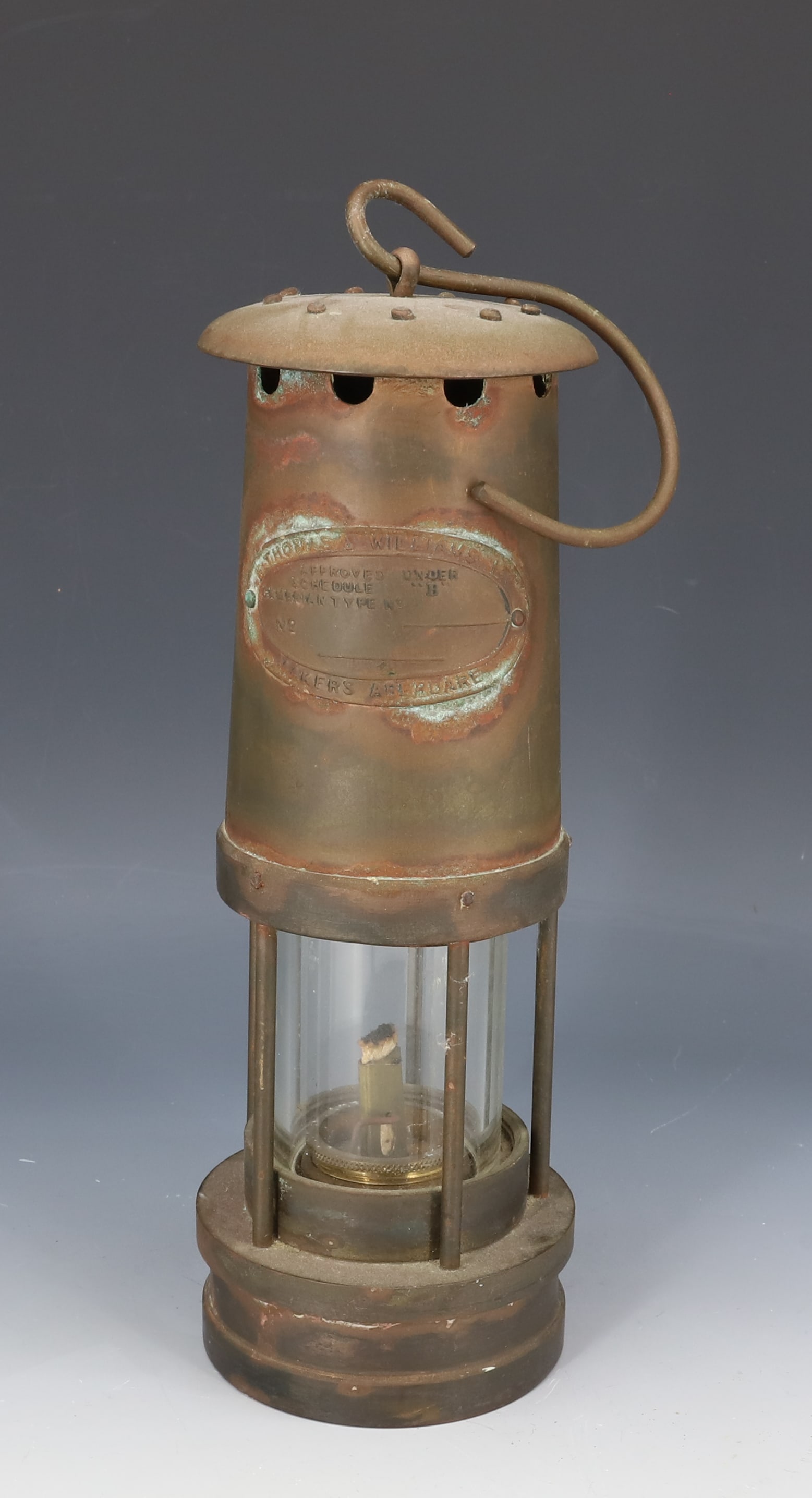 BRASS MINER'S LIGHT: "E. THOMAS & WILLIAMS, ABERDARE". HEAVY BRASS WITH CLEAR GLOBE. 10" H. PLEASE READ CAREFULLY - Terms for Purchasing and Shipping of Auction Items. Please read carefully before bidding. Hartzell?s Auct