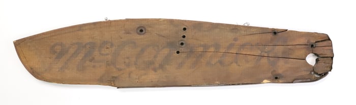 WOODEN "MCCORMICK" FRAGMENT