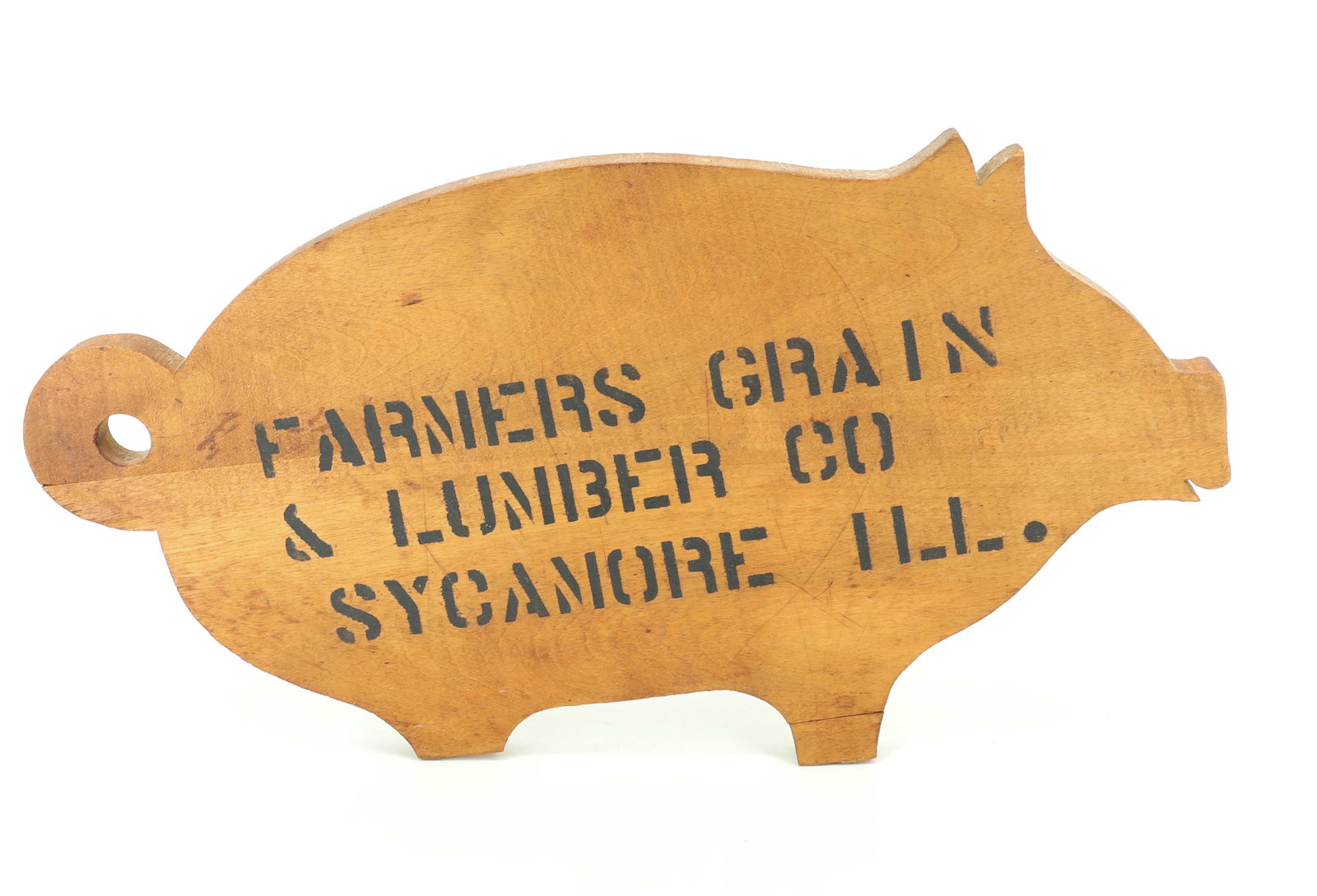 SYCAMORE, ILLINOIS CUTTING BOARD: WOODEN PIG MRKD. "FARMERS GRAIN & LUMBER CO. SYCAMORE, ILL" 16" L. PLEASE READ CAREFULLY - Terms for Purchasing and Shipping of Auction Items. Please read carefully before bidding. Hartzell?s Auction 