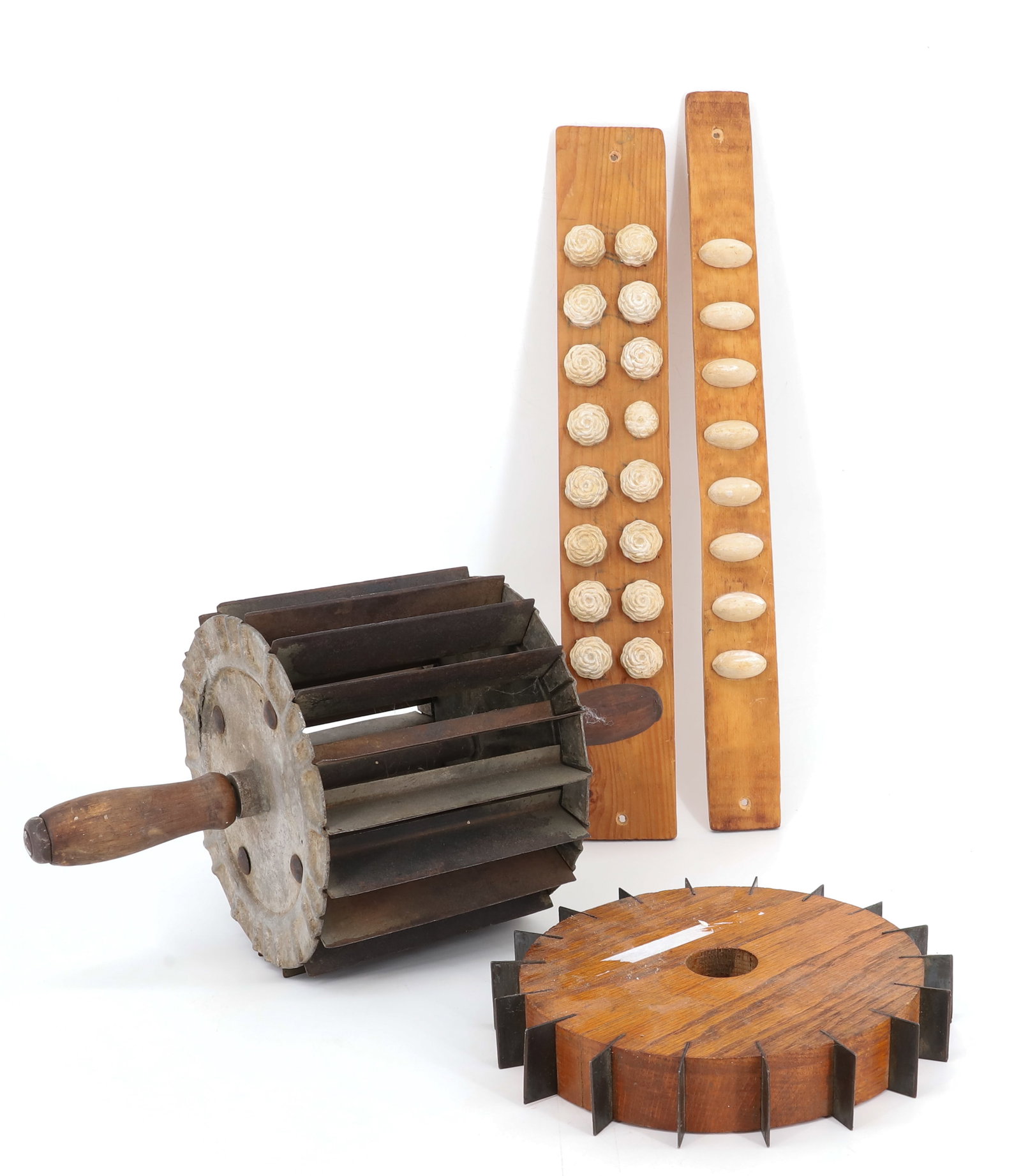 LOT OF DOUGH CUTTERS AND CANDY MOLDS: "MILLER BUN DIVIDER, PAT. 1907 " WITH WOODEN HANDLES 14" WIDE, SMALL DOUGH CUTTER AND TWO STRIPS OF CANDY MOLDS. PLEASE READ CAREFULLY - Terms for Purchasing and Shipping of Auction Items. Please read