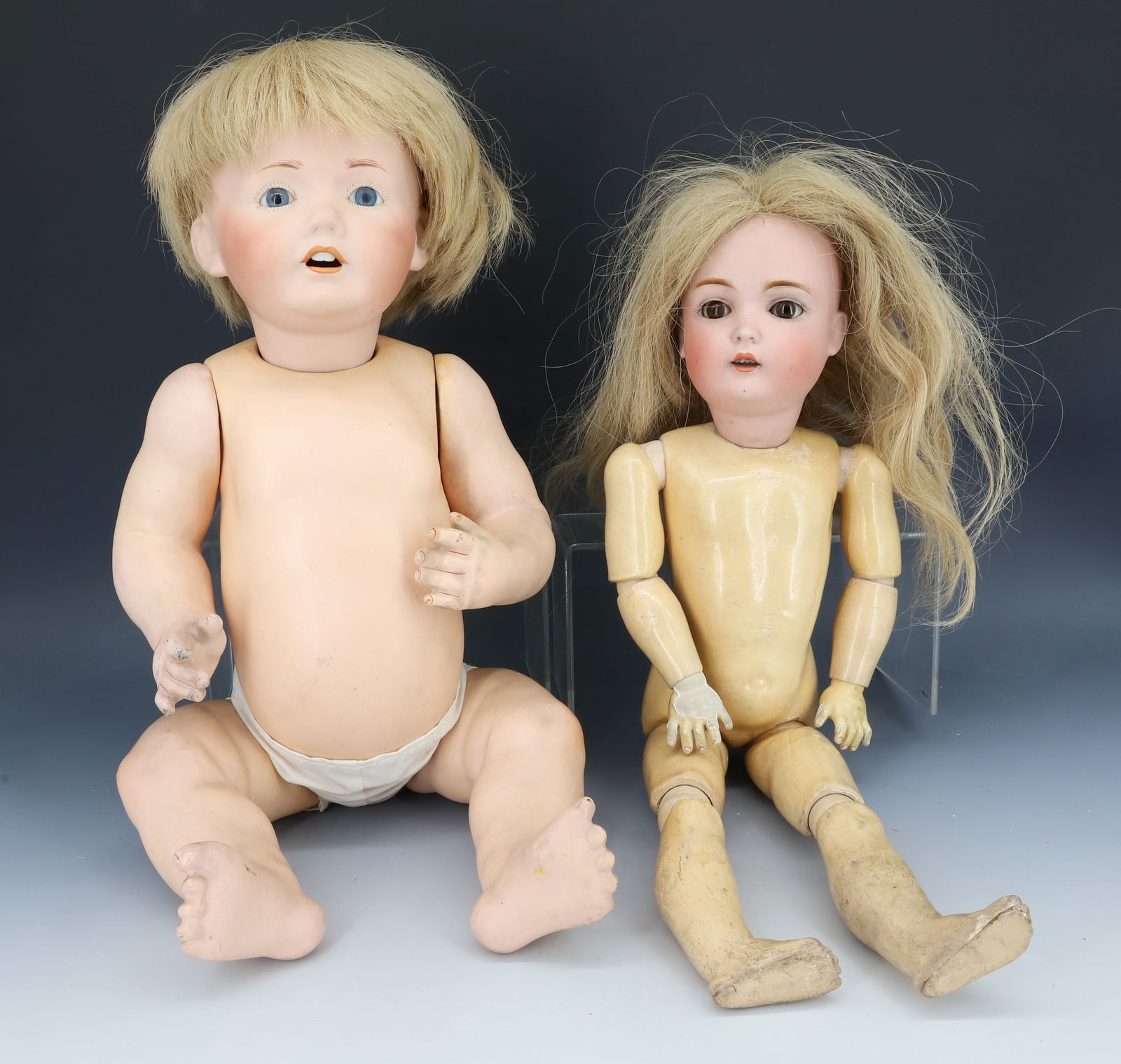 (2) GERMAN DOLLS: BISQUE HEAD AND JOINTED COMPOSITION BODY. SLEEP EYES, OPEN MOUTH. MRKD. 171, D 1/4 AND 8 1/4 ON HEAD. 18 1/2" L. OTHER HAS BISQUE HAD AND COMPOSITION BODY. FIXED EYES, OPEN MOUTH. MRKD. MADE IN GERMAN