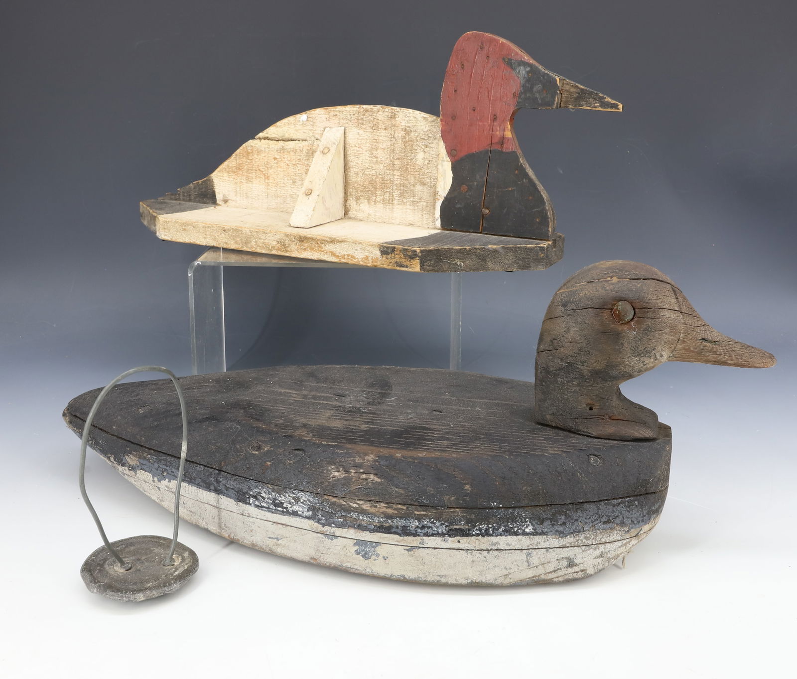 (2) FOLK ART DUCK DECOYS: PAINTED SURFACES. HANDMADE. ONE WITH LEAD WEIGHT. 13 3/4" TO 16 1/4" LENGTHS. PLEASE READ CAREFULLY - Terms for Purchasing and Shipping of Auction Items. Please read carefully before bidding. Hartzell
