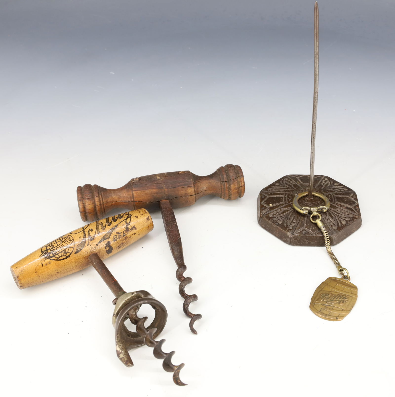 SCHLITZ BEER ADVERTISING AND MORE: "SCHLITZ" CORKSCREW AND KEYCHAIN, UNMARKED CORKSCREW AND CAST IRON RECEIPT SPINDLE. PLEASE READ CAREFULLY - Terms for Purchasing and Shipping of Auction Items. Please read carefully before bidding. Ha