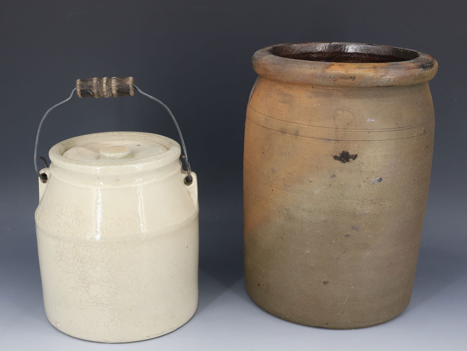 (2) STONEWARE CROCKS: STONEWARE PRESERVE JAR 9 1/2" H. AND LIDDED CROCK WITH BAIL HANDLE. PLEASE READ CAREFULLY - Terms for Purchasing and Shipping of Auction Items. Please read carefully before bidding. Hartzell?s Auction