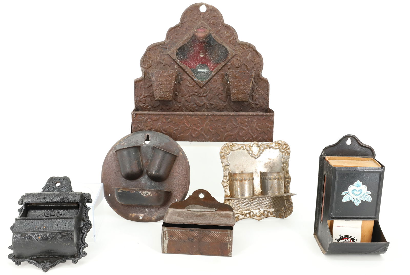 LOT OF TIN / CAST IRON MATCH HOLDERS: EMBOSSED TIN IN A VARIETY OF SIZES AND STYLES. LARGEST 8 3/4" X 9". BLACK PAINTED CAST IRON EXAMPLE " C. PARKER, PAT. 1870". PLEASE READ CAREFULLY - Terms for Purchasing and Shipping of Auction Items.