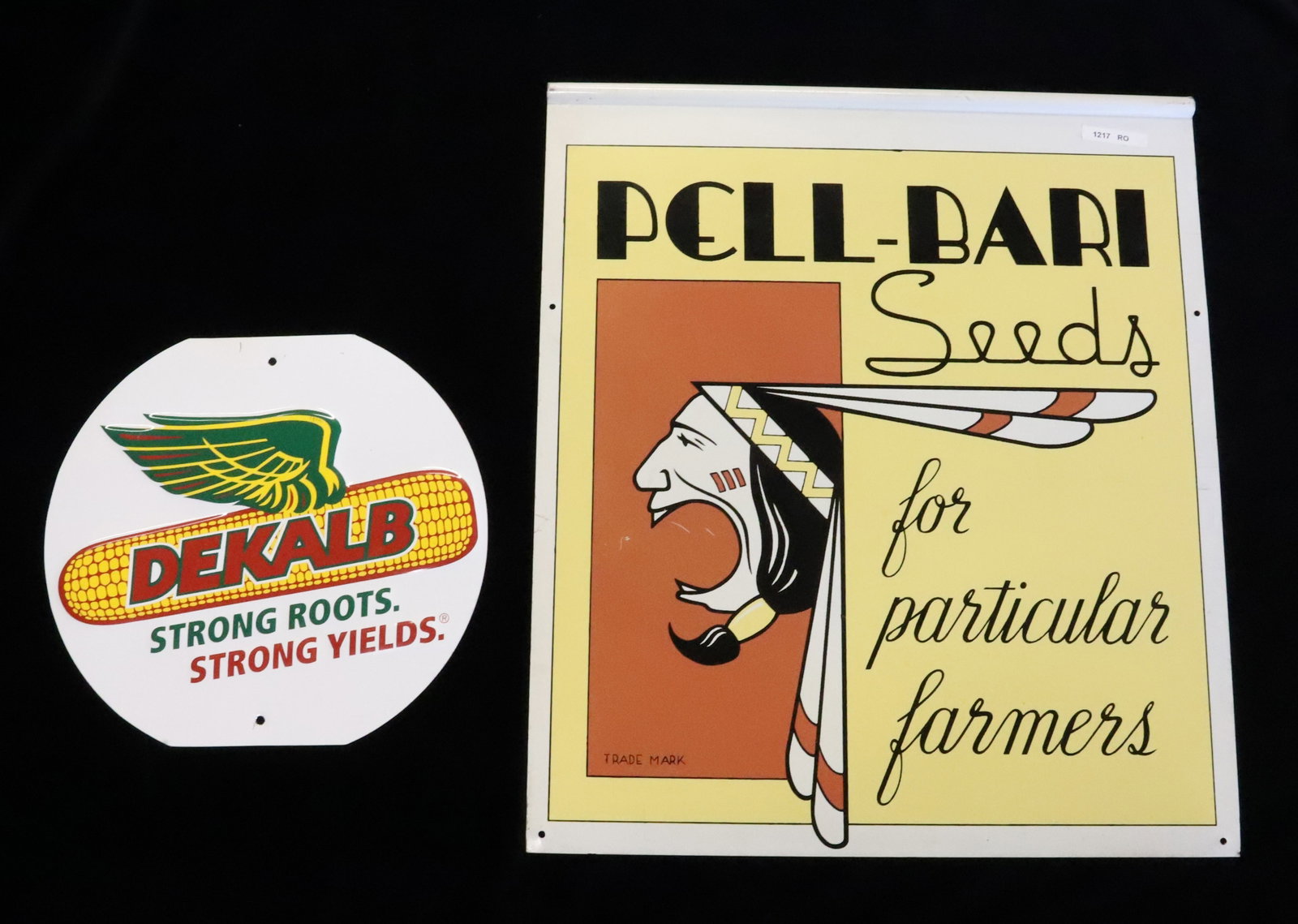 (2) SEED ADVERTISING SIGNS: INCLUDING: DOUBLE-SIDED "PELL-BARI SEEDS, FOR PARTICULAR FARMERS" (VERNON CO., NEWTON, IA" 23" X 20" AND "DEKALB" 12" X 13". PLEASE READ CAREFULLY - Terms for Purchasing and Shipping of Auction Items.