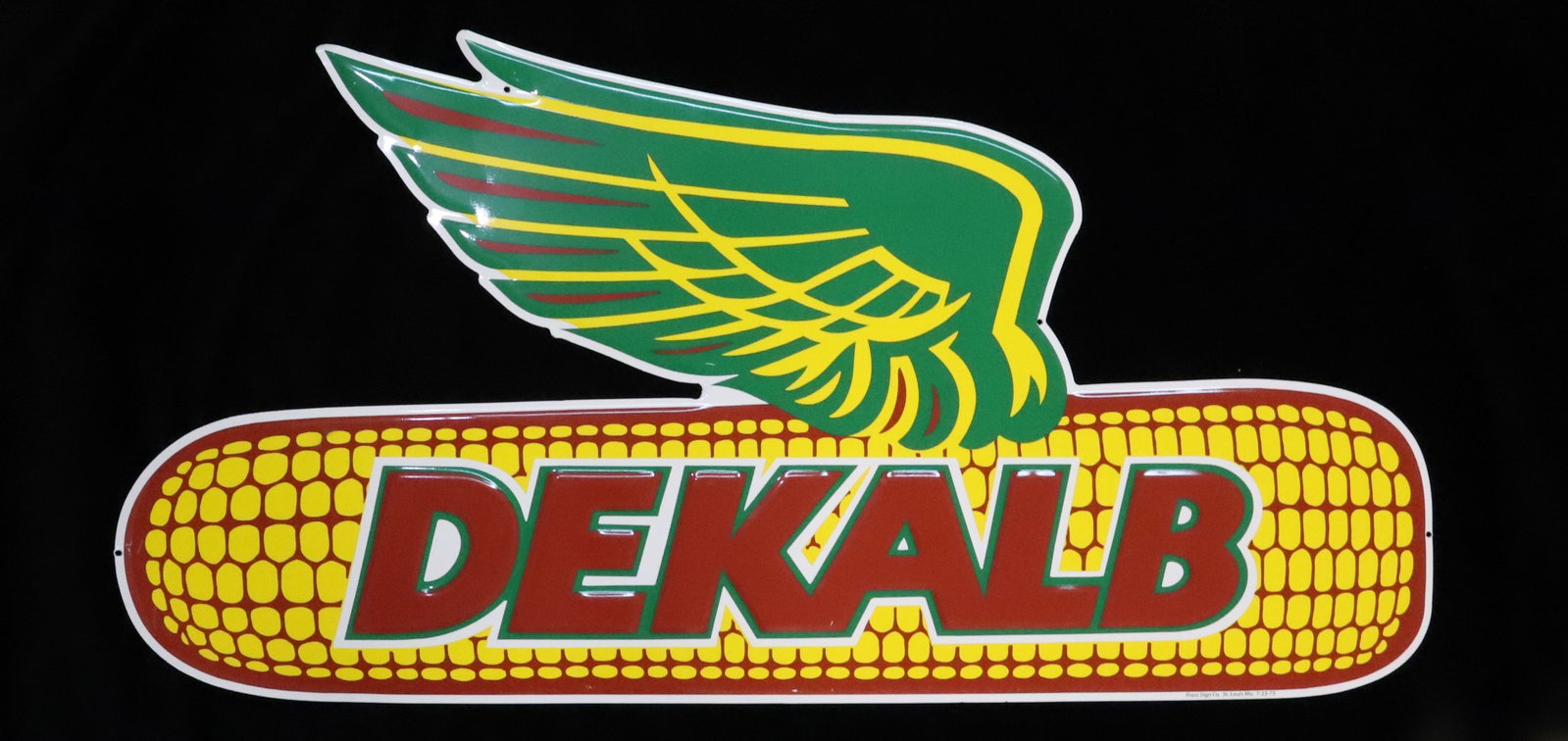 "DEKALB" ADVERTISING SIGN: PAINTED PRESSED METAL. 18" X 36 1/4". MRKD. PRESS SIGN CO. 7-23-73. PLEASE READ CAREFULLY - Terms for Purchasing and Shipping of Auction Items. Please read carefully before bidding. Hartzell?s Auction