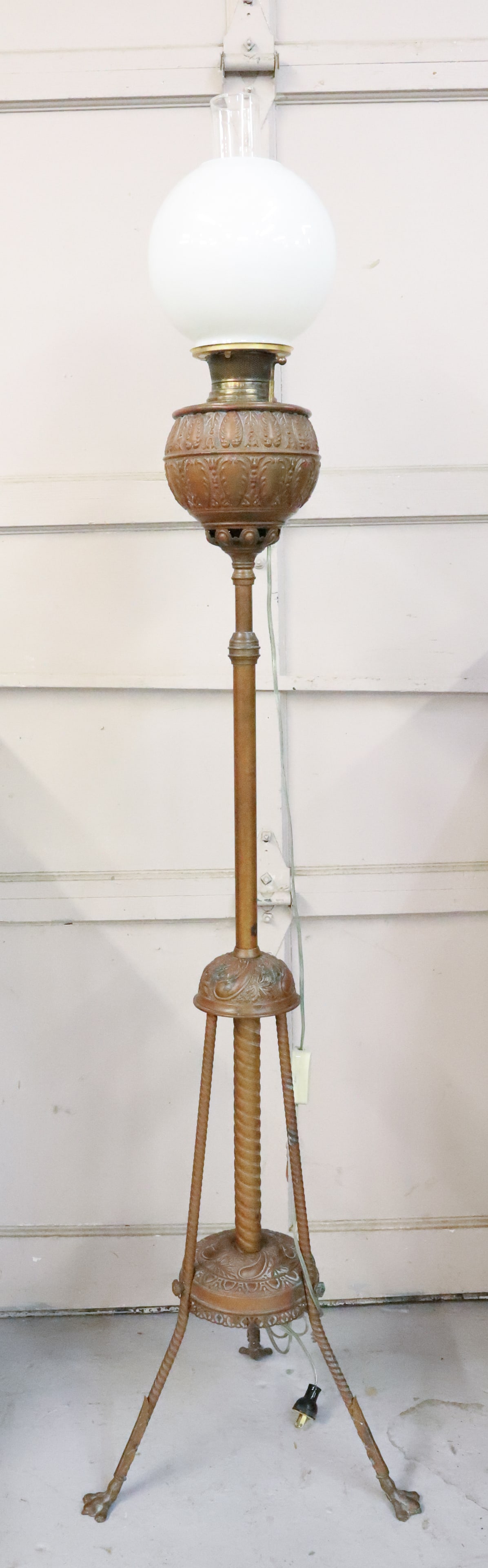 VICTORIAN PARLOR LAMP: KEROSENE FLOOR LIGHT. BRASS AND EMBOSSED COPPER. CLAW FEET. 61 1/2" H. ELECTRIFIED. PLEASE READ CAREFULLY - Terms for Purchasing and Shipping of Auction Items. Please read carefully before bidding. Ha