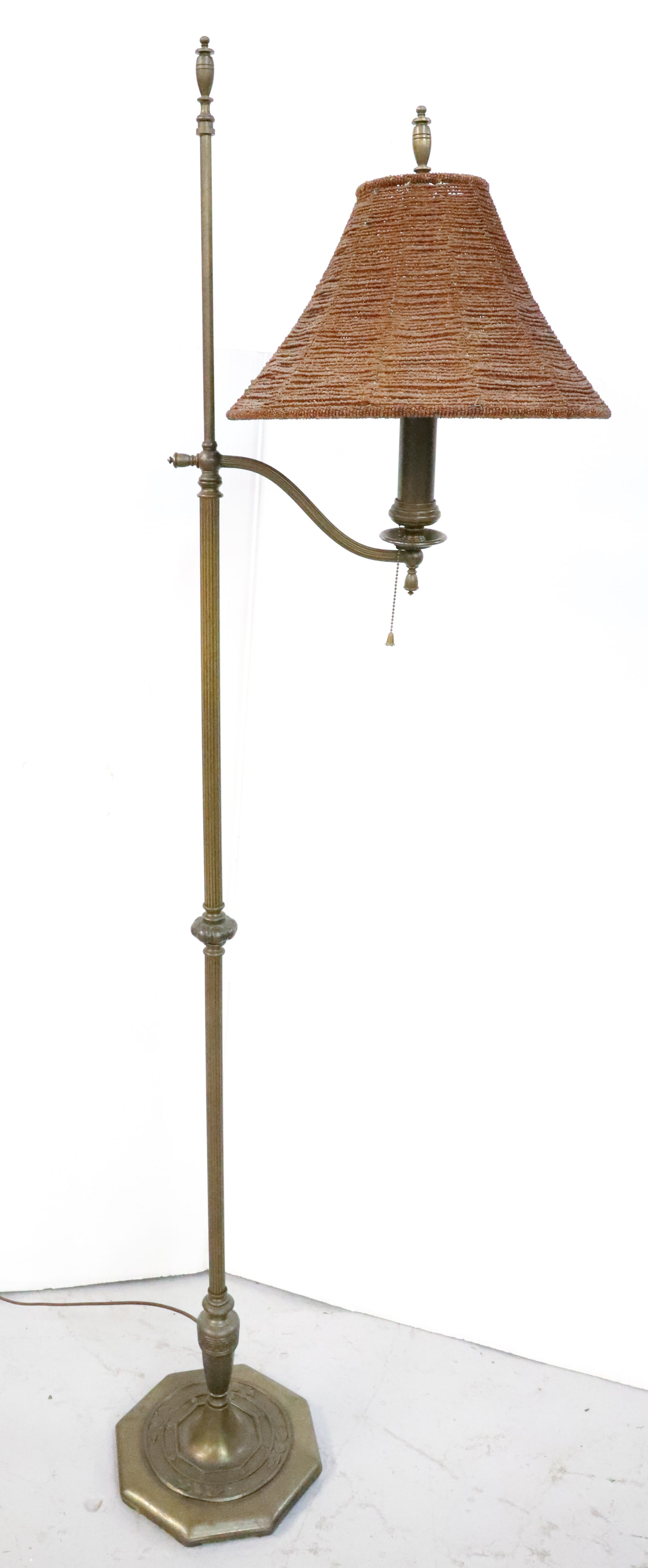 VINTAGE BRASS FLOOR LAMP: OCTAGONAL FLORAL BASE. BEADED SHADE. 56 3/4" H. X 14". PLEASE READ CAREFULLY - Terms for Purchasing and Shipping of Auction Items. Please read carefully before bidding. Hartzell?s Auction Gallery. Har