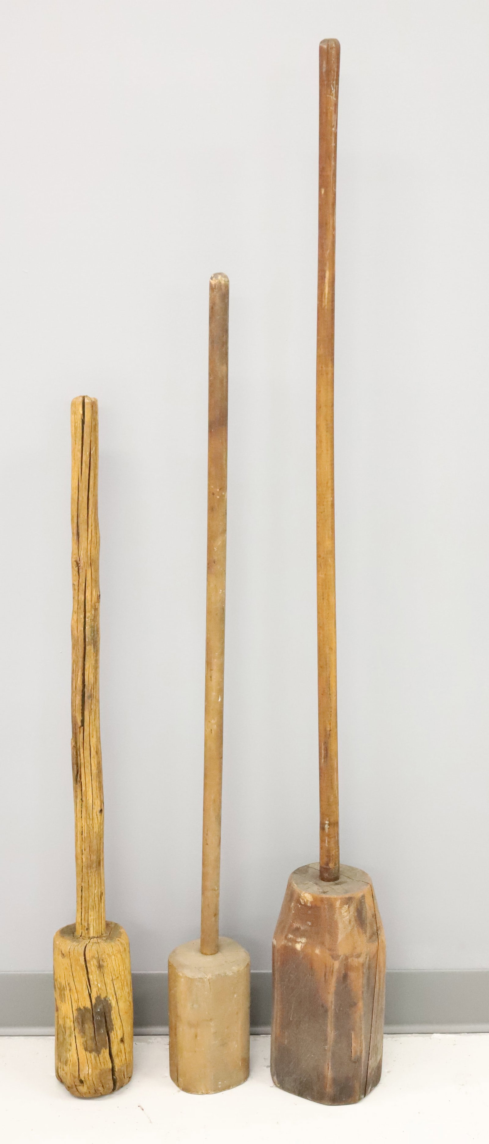 LOT OF PRIMITIVE WOODEN STOMPERS: THREE LARGE SAUERKRAUT STOMPERS. 36" TO 52" HEIGHTS. PLEASE READ CAREFULLY - Terms for Purchasing and Shipping of Auction Items. Please read carefully before bidding. Hartzell?s Auction Gallery. Hartz