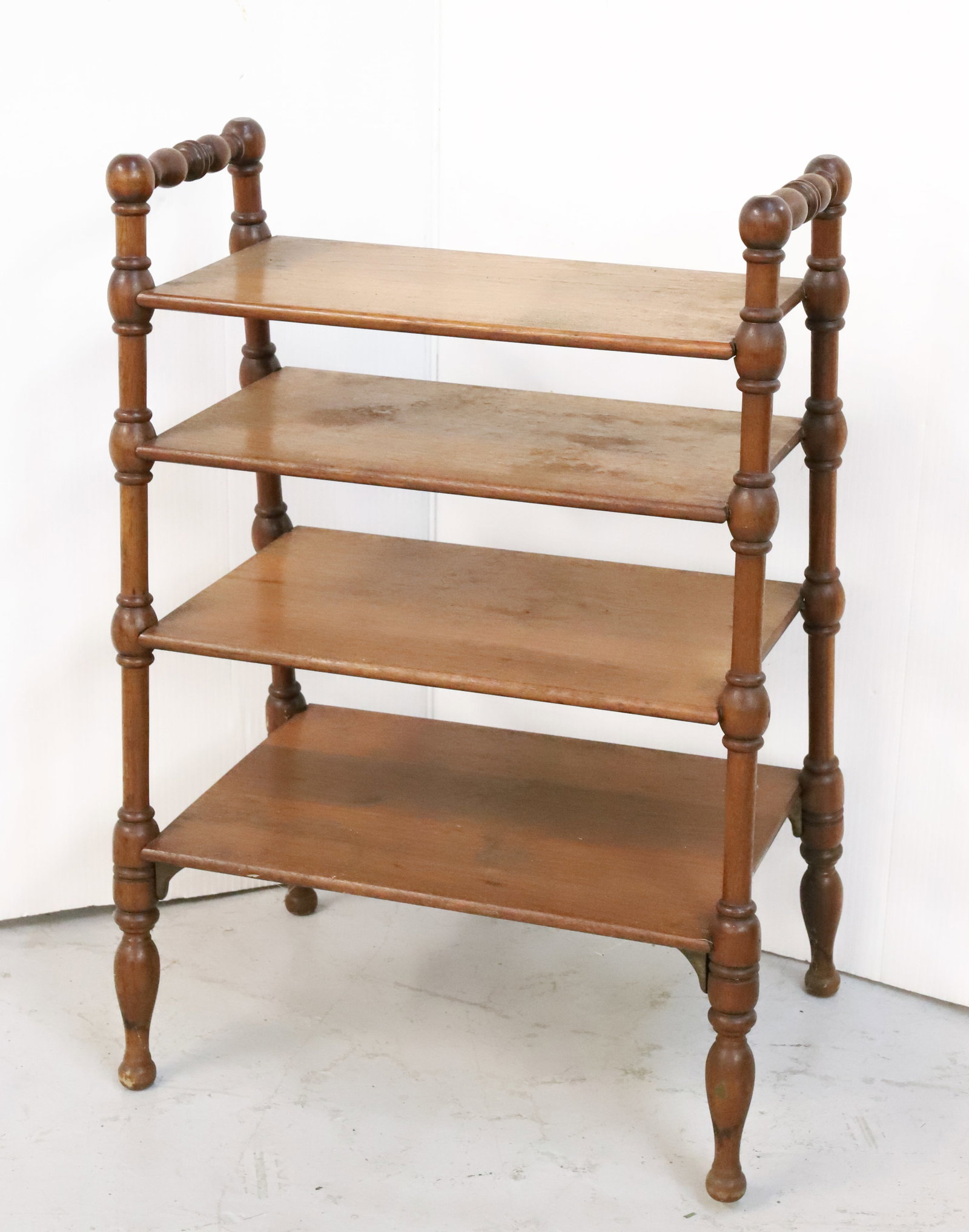 ANTIQUE WOODEN SHELVING: FOUR SHELVES ON TURNED WOODEN LEGS. 25 1/2" X 18" X 12 1/2". PLEASE READ CAREFULLY - Terms for Purchasing and Shipping of Auction Items. Please read carefully before bidding. Hartzell?s Auction Galler