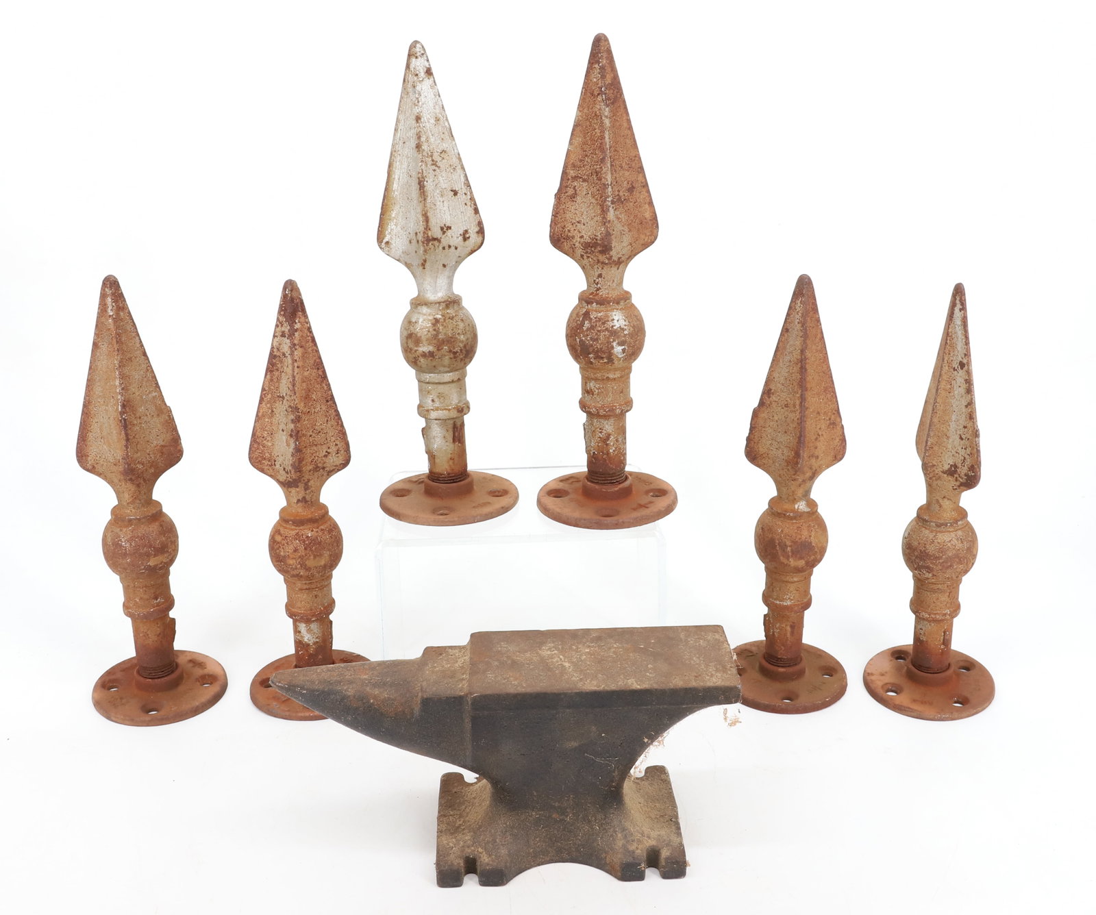 IRON ANVIL AND FINIALS: UNMARKED ANVIL 8 1/2" L. WITH, SIX IRON FINIALS 9 1/2" H. PLEASE READ CAREFULLY - Terms for Purchasing and Shipping of Auction Items. Please read carefully before bidding. Hartzell?s Auction Gallery. 