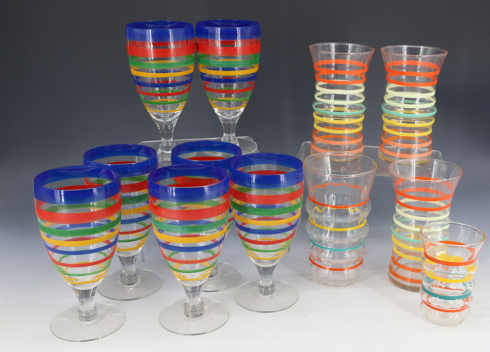 LOT OF VINTAGE STRIPED GLASSES: (7) BOLDLY STRIPED GOBLETS 6" H. AND (3) MATCHING 5 1/4" H., AND ONE 5 1/2" H. AND ONE 3 3/4" H. PLEASE READ CAREFULLY - Terms for Purchasing and Shipping of Auction Items. Please read carefully befor