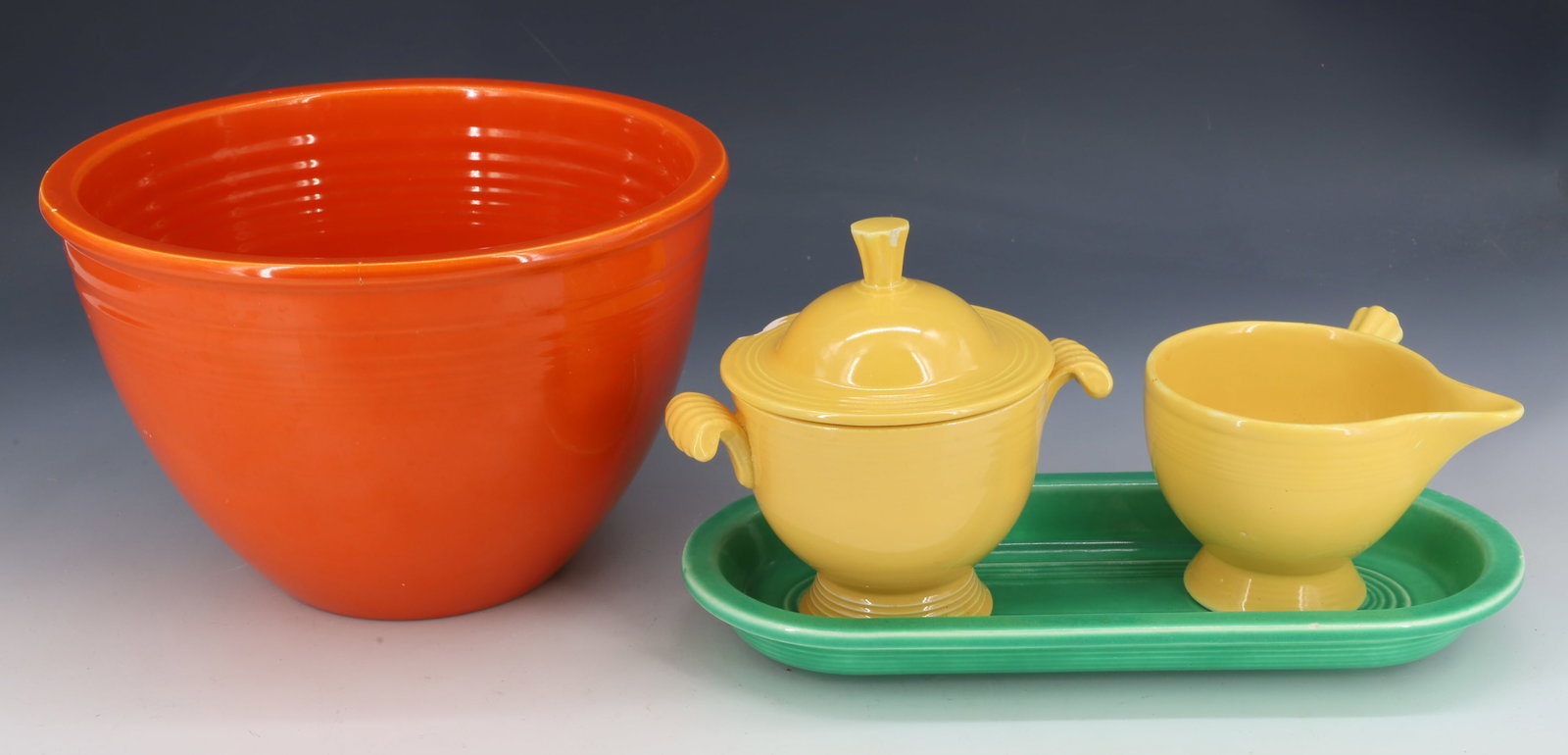 LOT OF VINTAGE FIESTA WARE: INCLUDING: 5 1/2" X 8 5/8". MRKD. ON BOTTOM. PLUS, YELLOW SUGAR CREAMER AND GREEN OVAL PLATE. PLEASE READ CAREFULLY - Terms for Purchasing and Shipping of Auction Items. Please read carefully before b