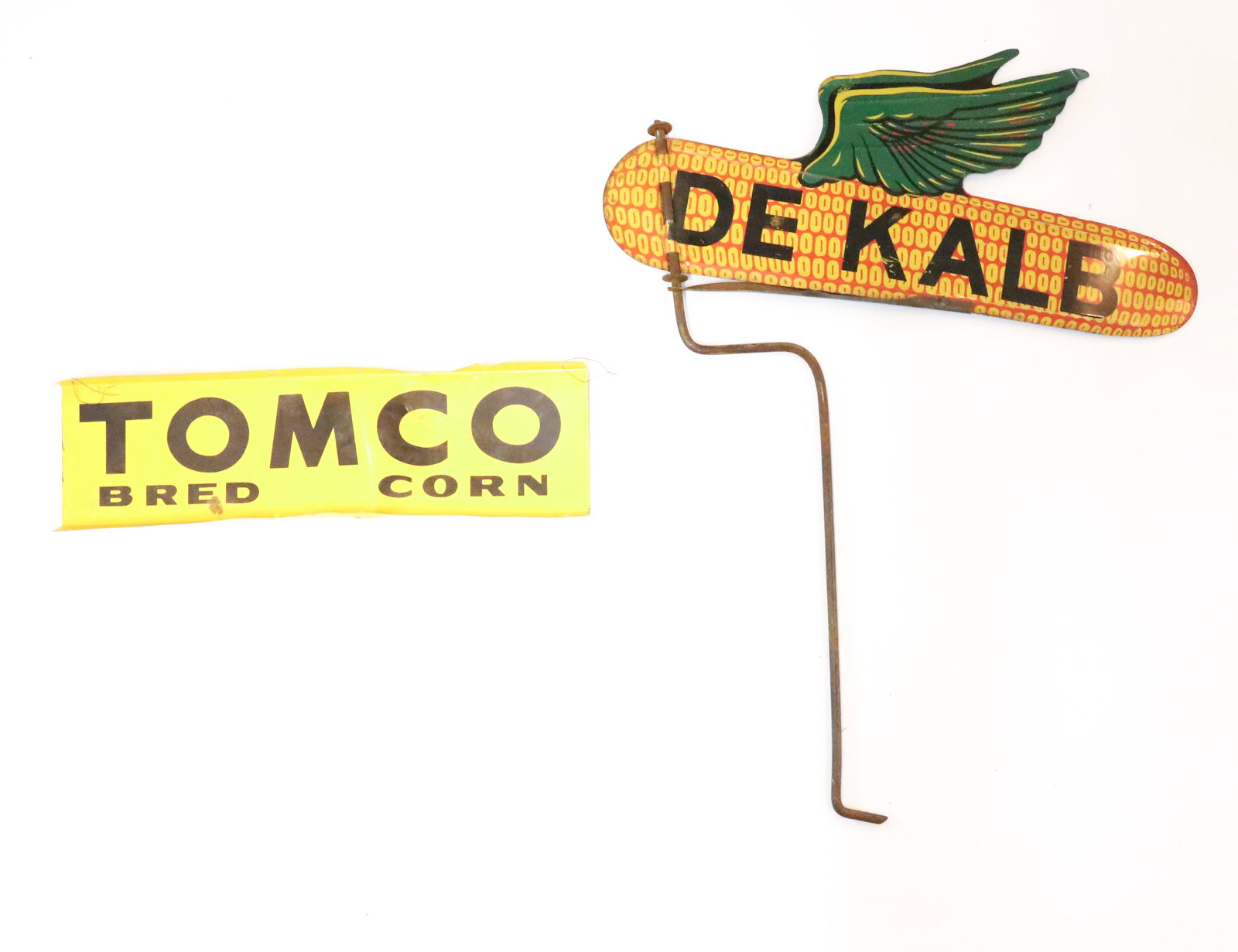 (2) TIN ADVERTISING SIGNS: PAINTED METAL. "TOMCO BRED CORN" DOUBLE-SIDED 16" L. WITH, DOUBLE-SIDED DEKALB ON METAL ROD. 18" X 21". PLEASE READ CAREFULLY - Terms for Purchasing and Shipping of Auction Items. Please read carefull