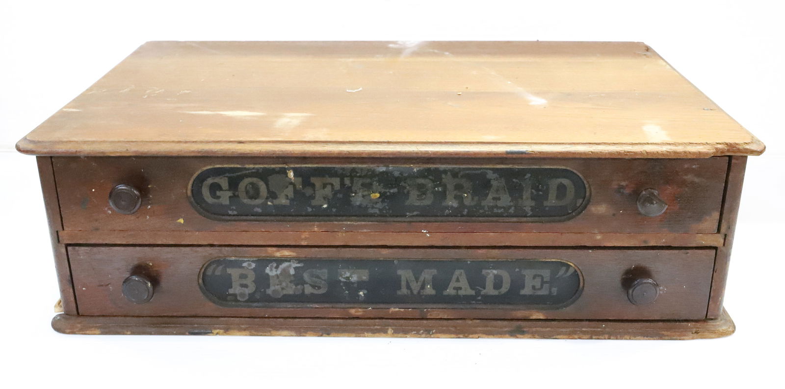 TWO-DRAWER SPOOL CABINET: "GOFF'S BRAND, BEST MADE" ON DRAWERS. 7 1/4" X 25 1/2" X 16". PLEASE READ CAREFULLY - Terms for Purchasing and Shipping of Auction Items. Please read carefully before bidding. Hartzell?s Auction Galle
