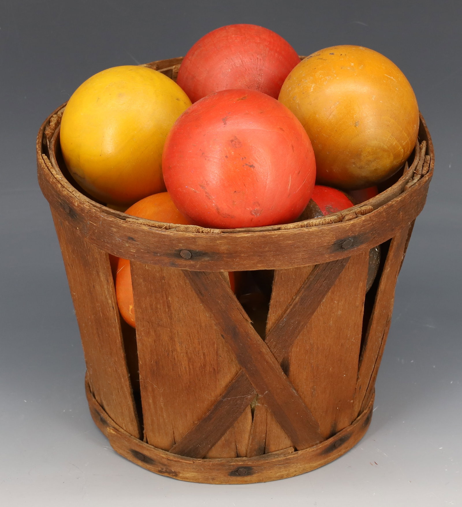 PRODUCE BASKET WITH VINTAGE BALLS: WOVEN WOODEN BASKET 5 1/2" X 7" WITH VARIETY OF SIZE/COLOR BALLS. PLEASE READ CAREFULLY - Terms for Purchasing and Shipping of Auction Items. Please read carefully before bidding. Hartzell’s Auc