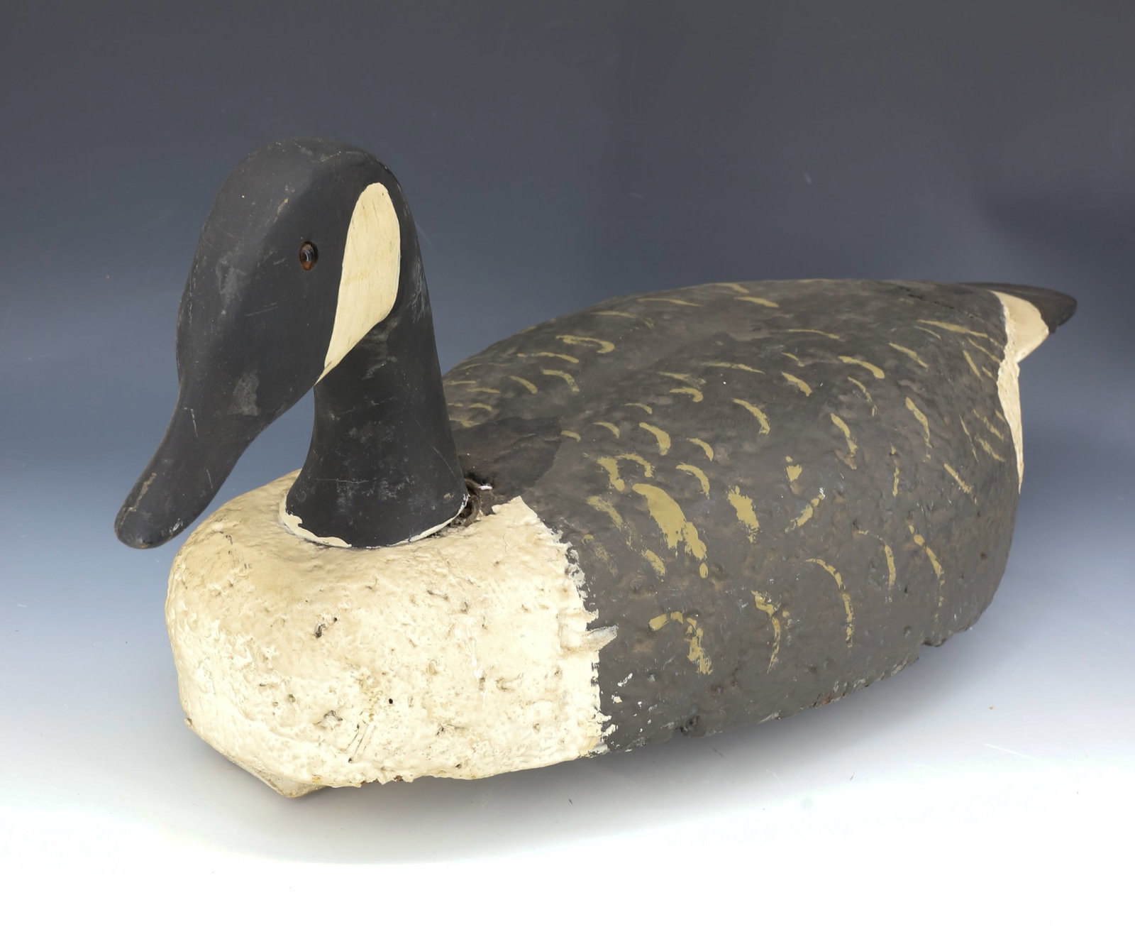 FOLK ART GOOSE DECOY: PAINTED CARVED HEAD WITH GLASS EYES. PAINTED BODY. 24 1/4" L. PLEASE READ CAREFULLY - Terms for Purchasing and Shipping of Auction Items. Please read carefully before bidding. Hartzell’s Auction
