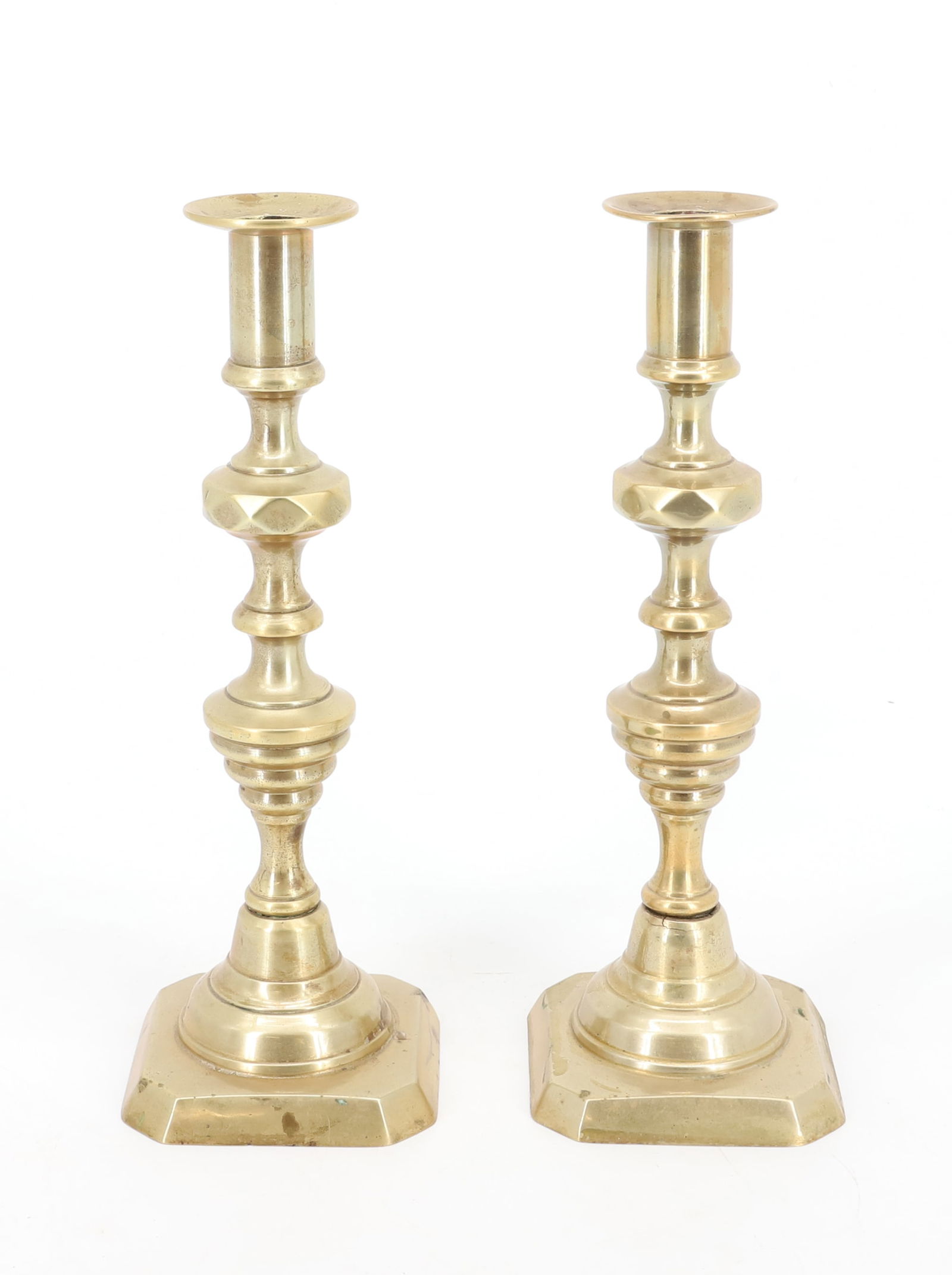 PAIR OF BRASS CANDLESTICKS: MATCHING PAIR OF PUSH-UP CANDLESTICKS. 10 3/4" H. PLEASE READ CAREFULLY - Terms for Purchasing and Shipping of Auction Items. Please read carefully before bidding. Hartzell’s Auction Gallery. Ha