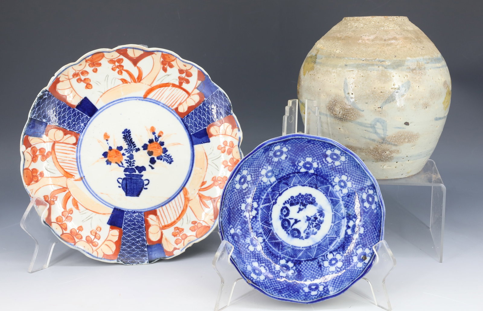 LOT OF ASIAN PORCELAIN / STONEWARE: TWO DECORATED PORCELAIN PLATES 5 1/2" AND 8 1/4" (IMARI) DIAMETERS (BOTH UNMARKED). WITH, STONEWARE JAR WITH WHITE GLAZE AND BLUE DECORATION. PLEASE READ CAREFULLY - Terms for Purchasing and Shipping